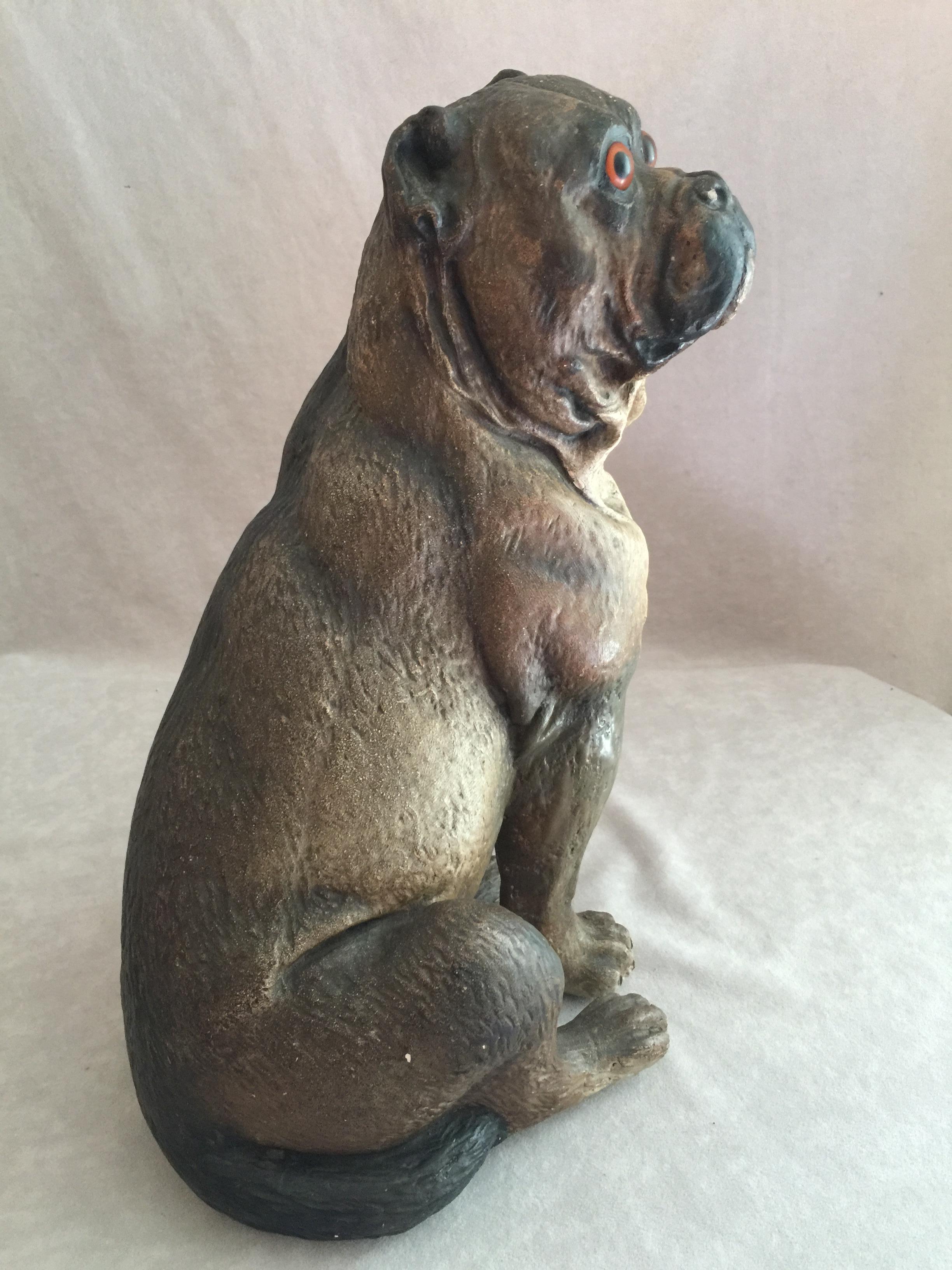 We find that some of the best examples of sculpted dogs can be found to be made of terracotta. This pug has the look of a real dog. The glass eyes, the beautifully accurately painted body, and the size, brings this sculpture to life. We are always