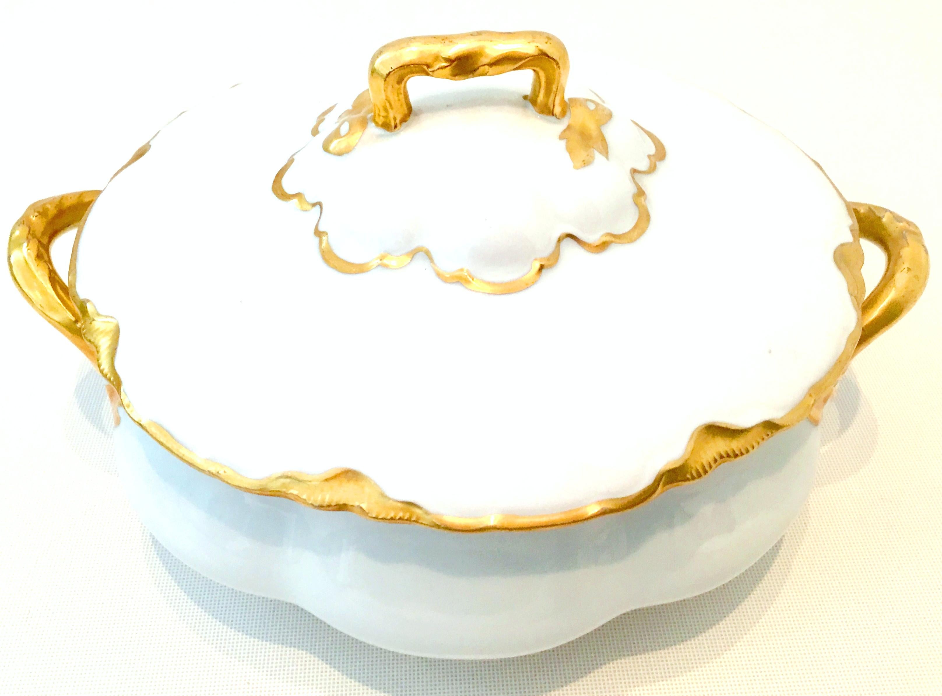 Antique Austrian Porcelain & 22K gold lidded tureen and large platter set of two pieces by, OSCAR & EDGAR GUTHERZ. . This classic and timeless pattern features a bright white ground with heavy 22K hand painted overlay detail and abstract leaf motif.