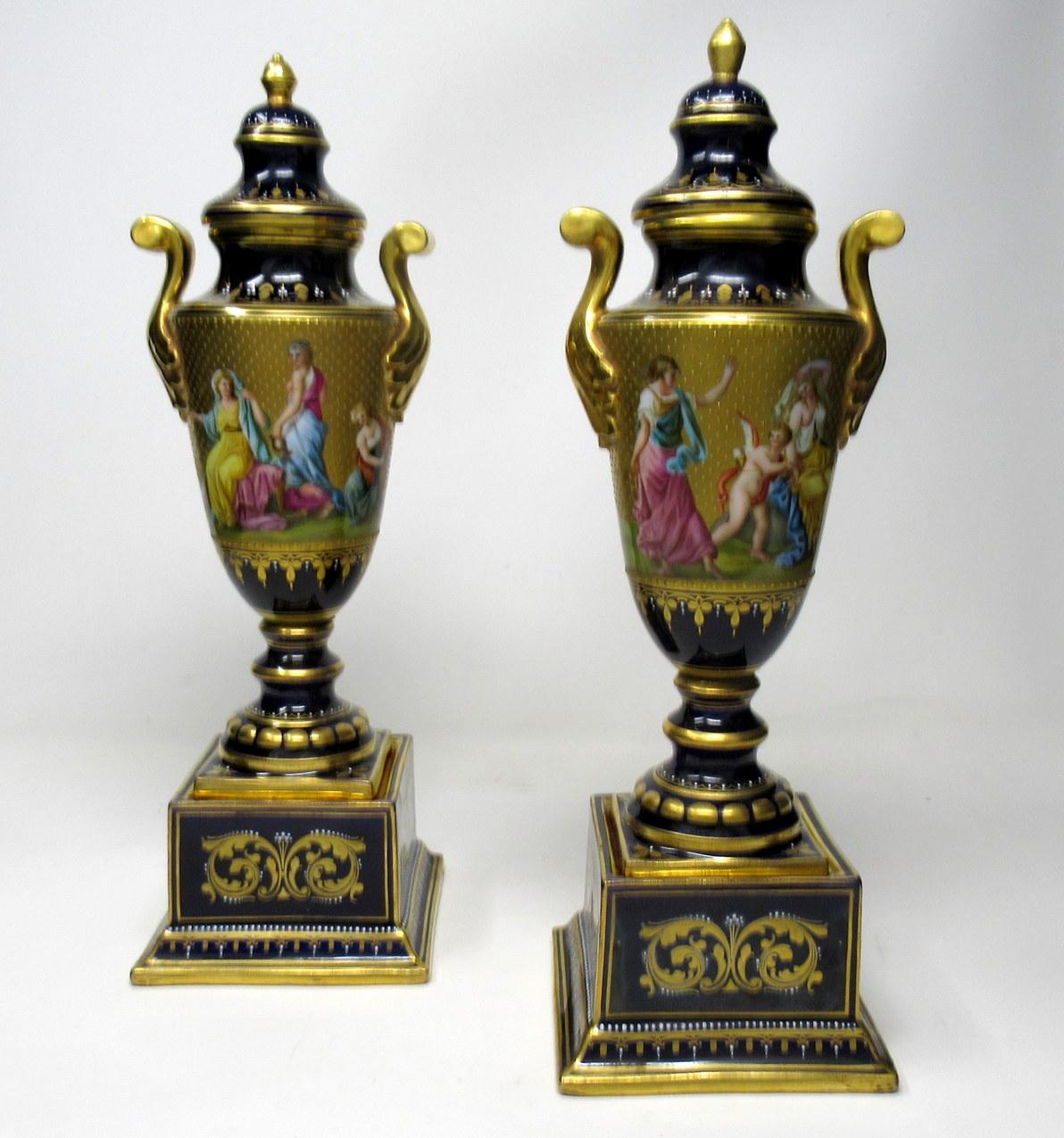 An exceptionally fine quality pair of Austrian Royal Vienna urns of outstanding quality, last half of the 19th century.

The all around frieze superbly hand painted with highly detailed decorations on gilt ground depicting Mythological Scenes,