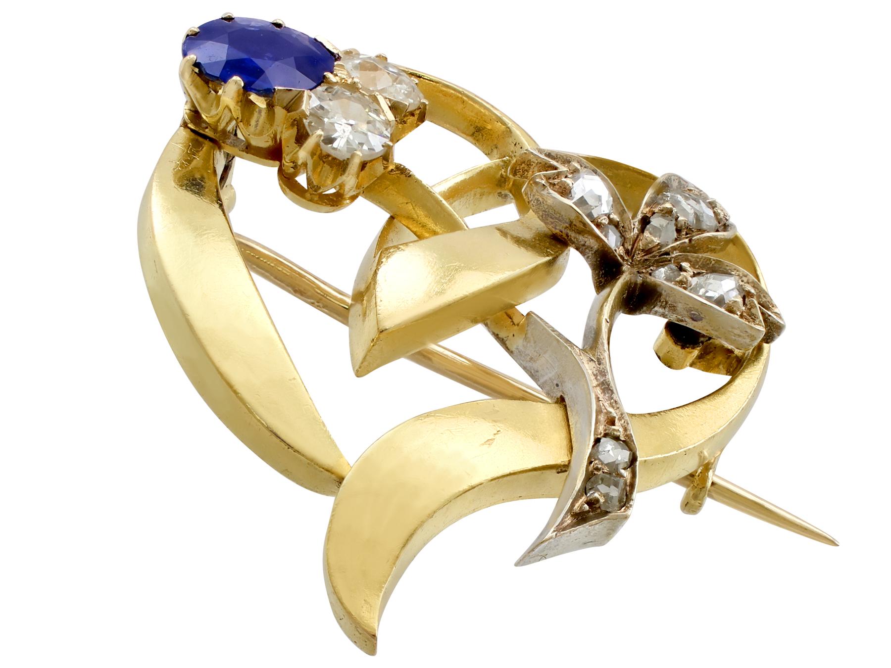 An impressive antique 0.45 carat sapphire and 0.60 carat diamond, 14 karat yellow gold heart shaped brooch; part of our diverse antique jewelry and estate jewelry collections.

This fine and impressive antique sapphire brooch has been crafted in 14k