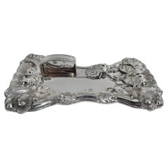 Ancien presse-bougies autrichien en argent sur support rococo