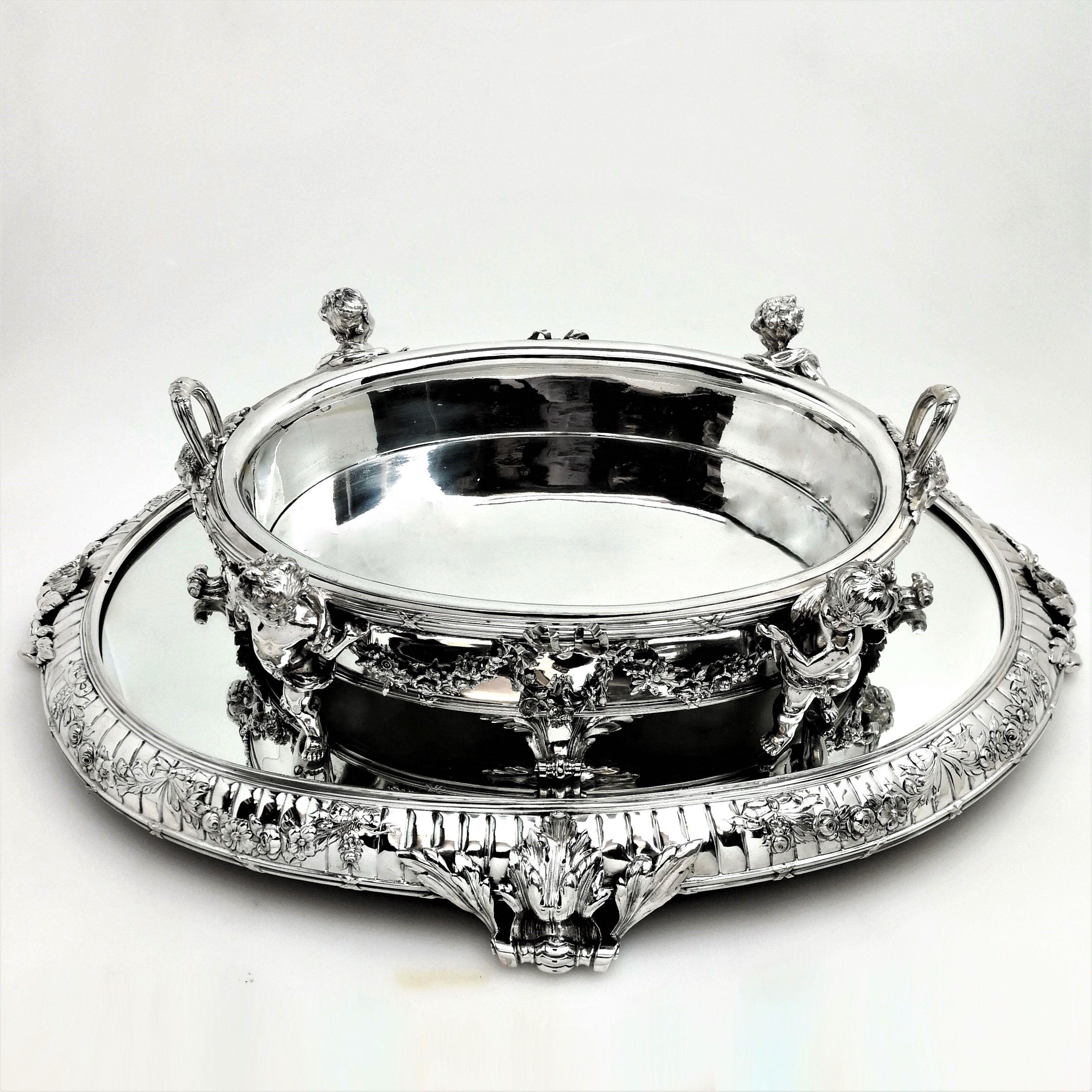 A magnificent Austrian antique silver centrepiece jardinière on plateau. This oval bowl stands on a substantial mirrored oval plateau tray, both of which can be used as an impressive centrepiece, or separately as a bowl or tray. The jardinière is