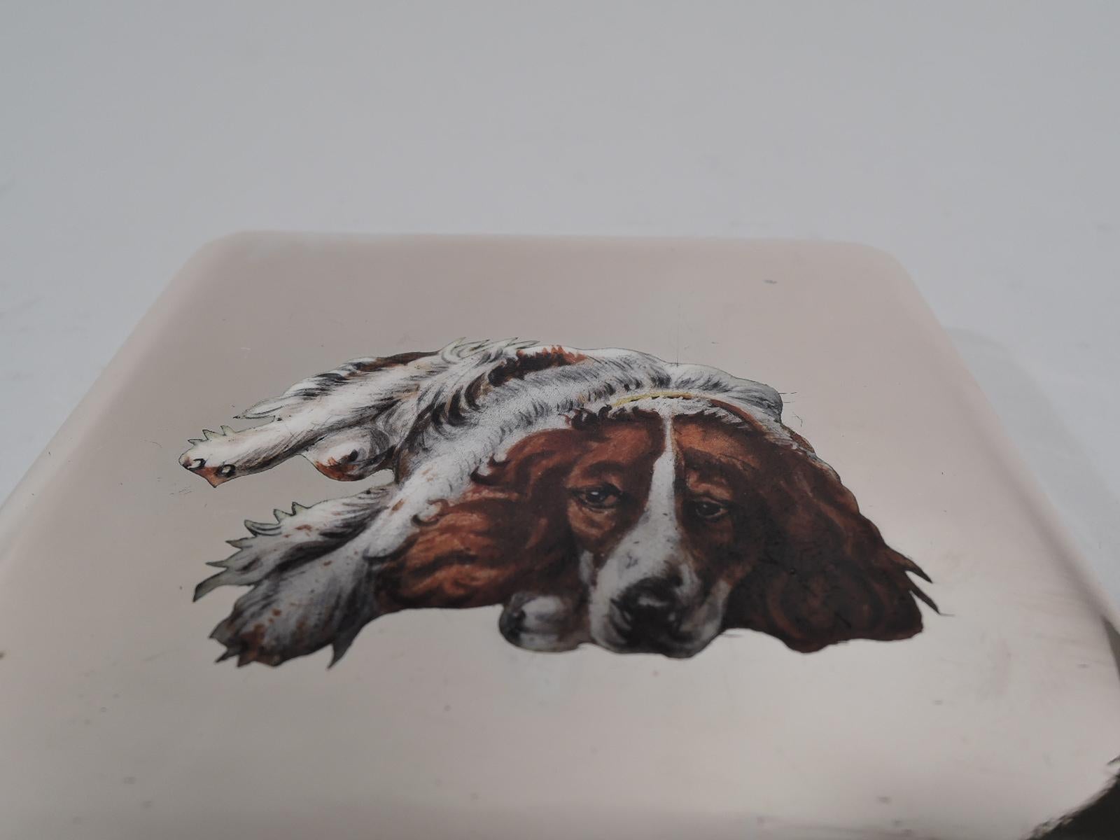 Austrian silver case, ca 1920. Square with concave sides. Cover hinged with curved tab and enameled dog: A floppy-eared spaniel with melancholy eyes. Interior gilt. Marked “800” and “Sterling”.  