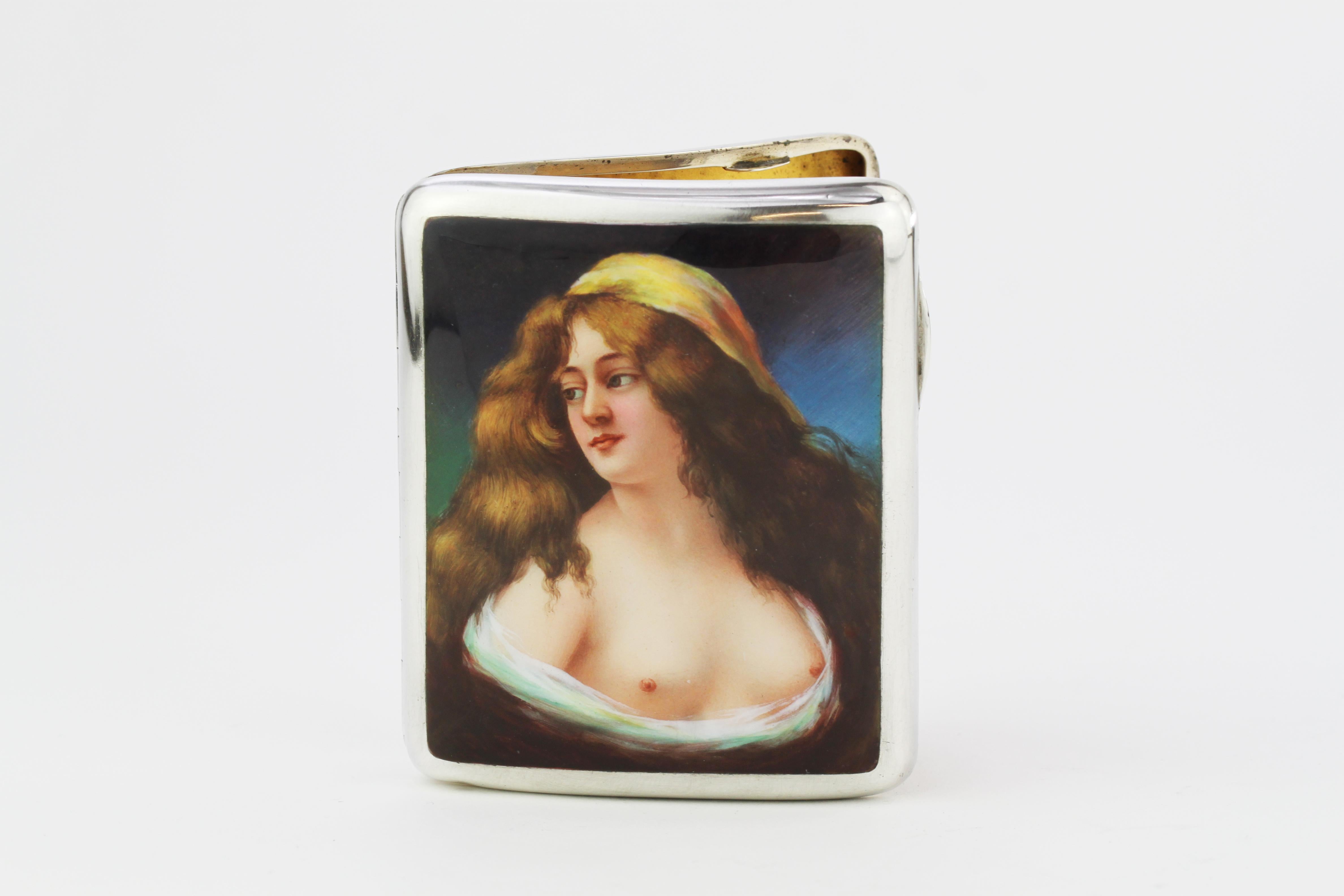 This exceptional antique Austrian sterling silver vesta case has a plain rectangular form with rounded corners.

The interior surface of the silver and enamel vesta case is ornamented with an impressive enamel panel depicting a semi-naked female