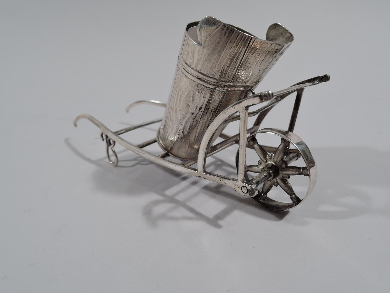 Austrian silver figural match holder, 1860. A pushcart with oval basket mounted to open frame. Spoked wheel rotates. Mark includes year. Weight: 1 troy ounce.