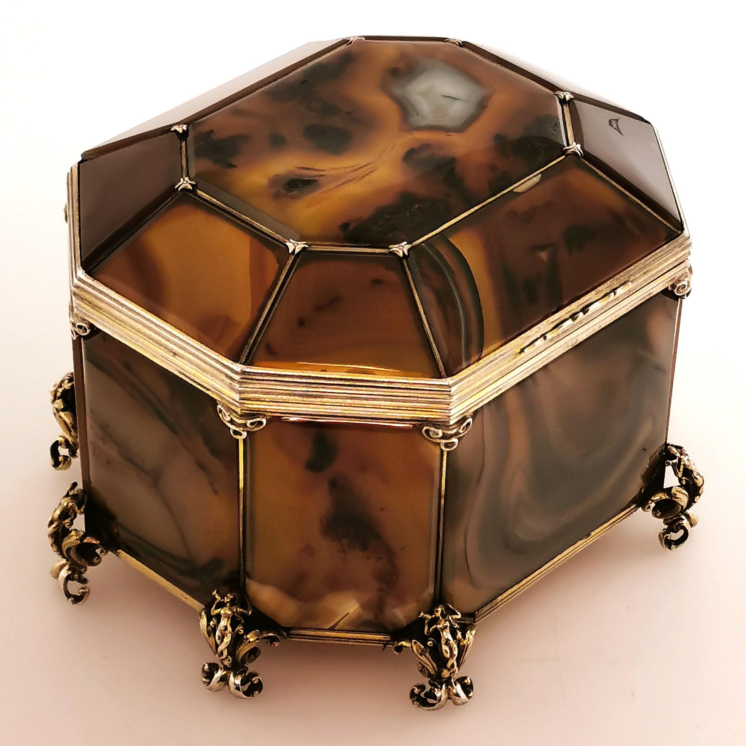 A gorgeous Antique Austrian Moss Agate and Silver Gilt Casket. This Box has a faceted octagonal shape as the panels of agate are mounted in an elegant silver gilt frame. The Casket stands on 8 ornate feet featuring a mythical creature blowing on a