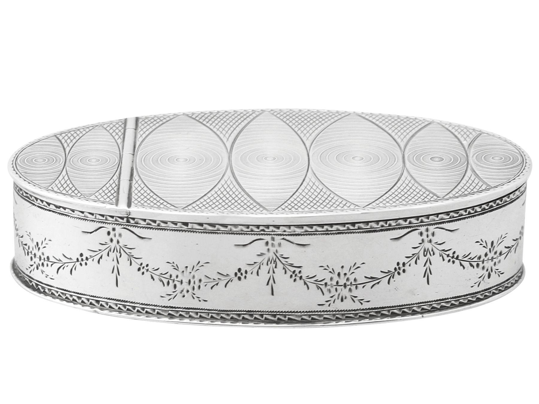 An exceptional, fine and impressive antique Austrian silver table snuff box; an addition to our ornamental silverware collection.

This exceptional antique Austrian silver table snuff box has a plain oval form.
The sides of the body are