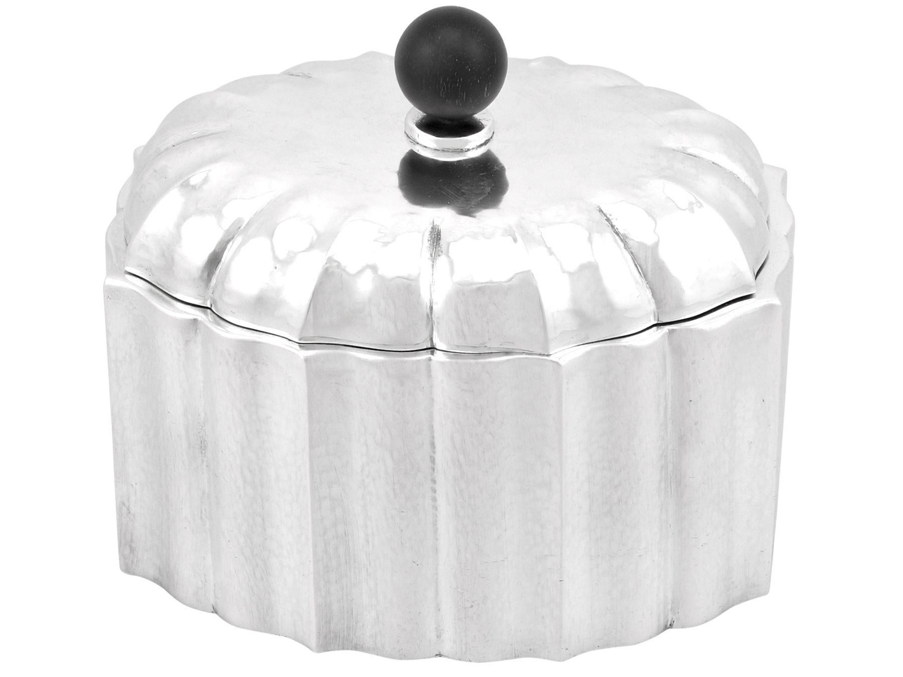 An exceptional, fine and impressive antique Austrian 800 standard silver tea caddy; an addition to our silver teaware collection.

This exceptional Austrian silver tea caddy has an oval shaped form.

The incurved panelled surface of this silver
