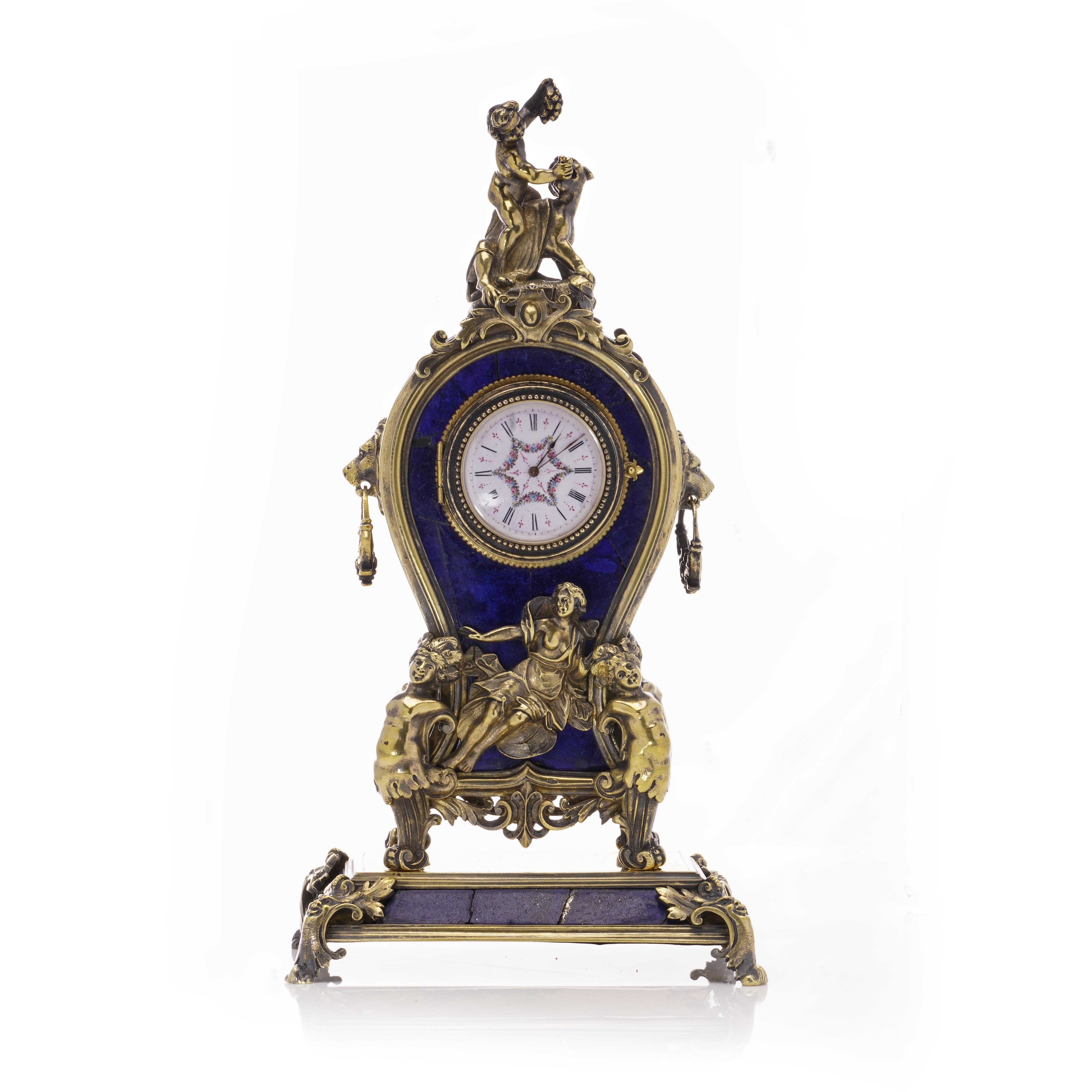 Step into the enchanting world of time with our Antique Austro-Hungarian 800 Silver and Lapis Lazuli Clock.

An opulent masterpiece that transcends the ordinary, weaving together silver and lapis lazuli in a symphony of ornate elegance.

This