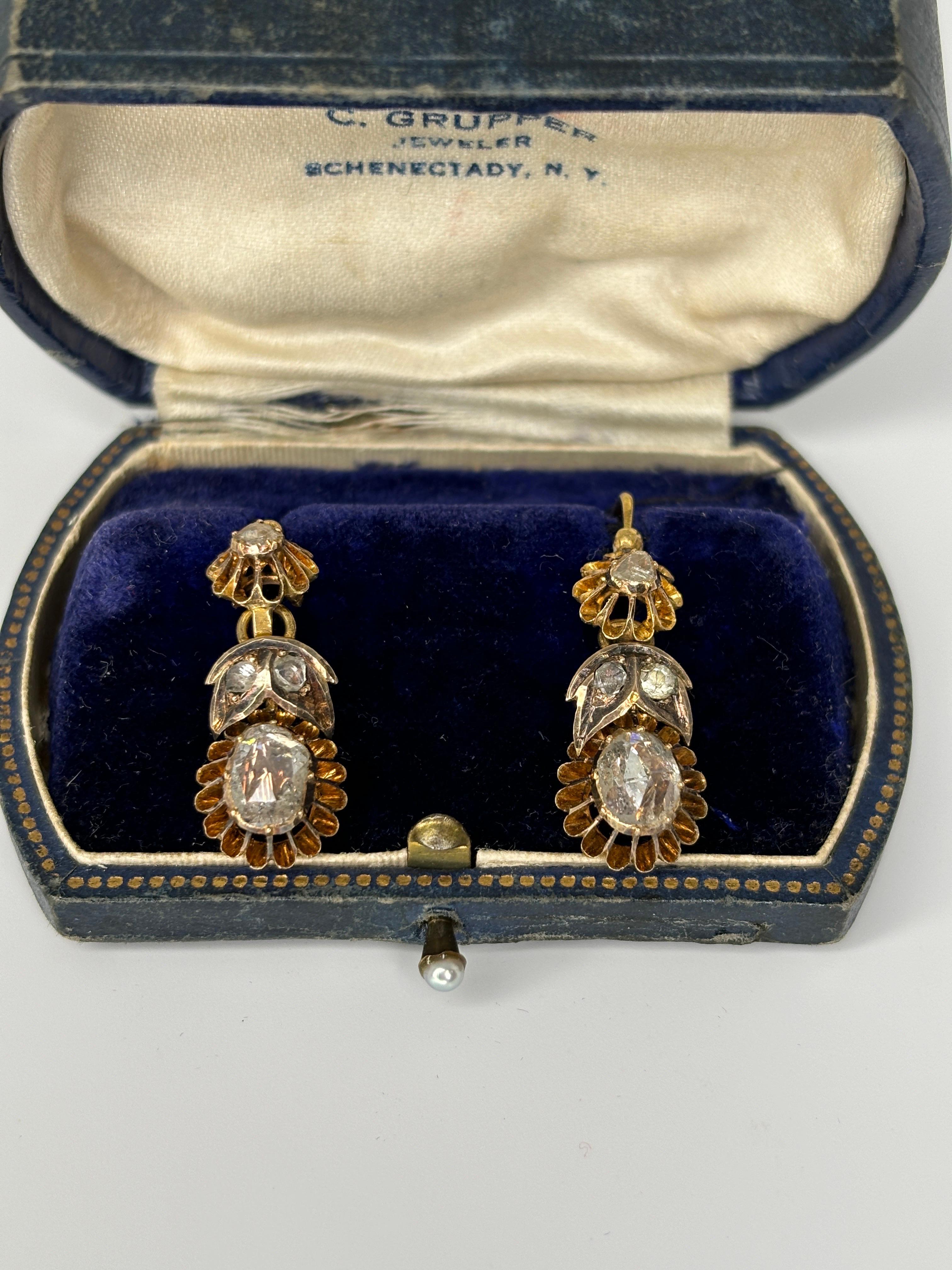 These beautiful earrings date back to the late 19th century, created during the Austro Hungarian empire. Hallmarks tell us these rare and charming, antique rose-cut diamond earrings hail from late-19th century.  Warm rosy-yellow 14 karat buttercup