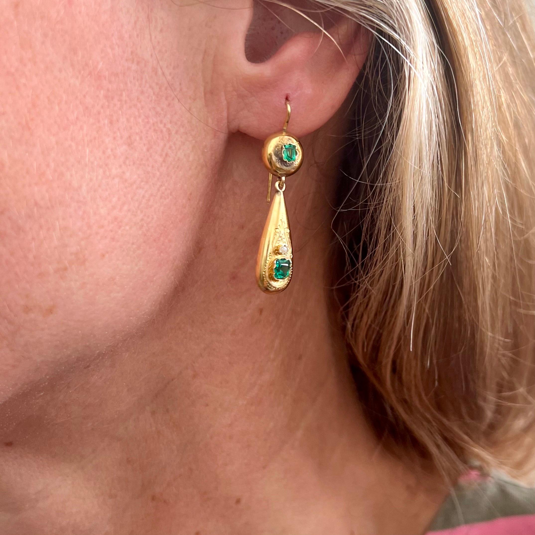 An elegant pair of antique drop earrings from the Austro-Hungarian Empire, finely crafted in 14 karat yellow gold and bearing the hallmark in use between 1866 and 1872. These earrings are a wonderful example of 19th-century Central European jewelry,