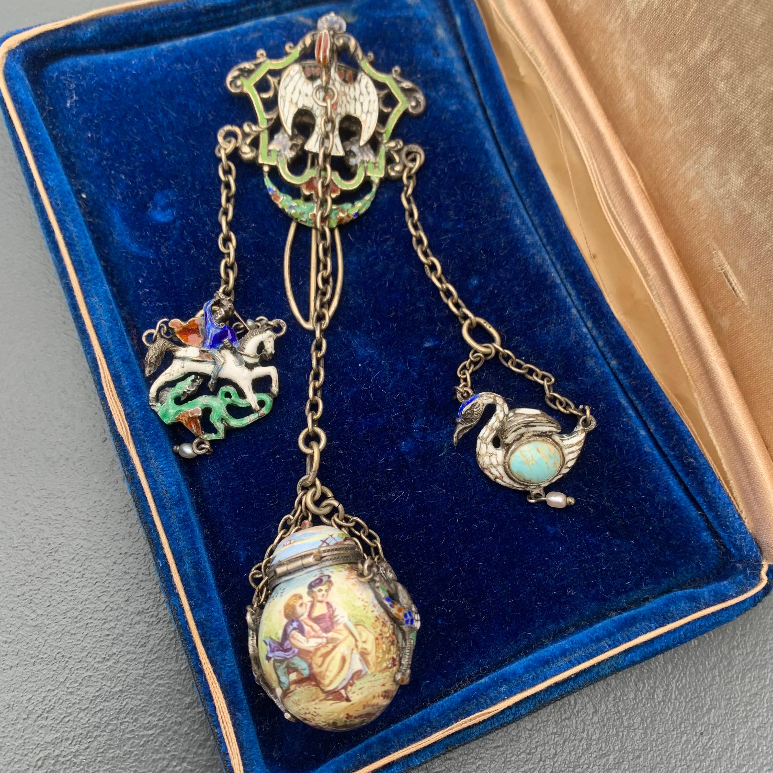 Absolutely Stunning details on this rare antique Renaissance Revival ,Austro Hungarian  gilt Silver and Enamel pomander Chatelaine pin . Beautifully hand painted with fine details .
Central Bottle pendant opens to reveal an hidden compartment which