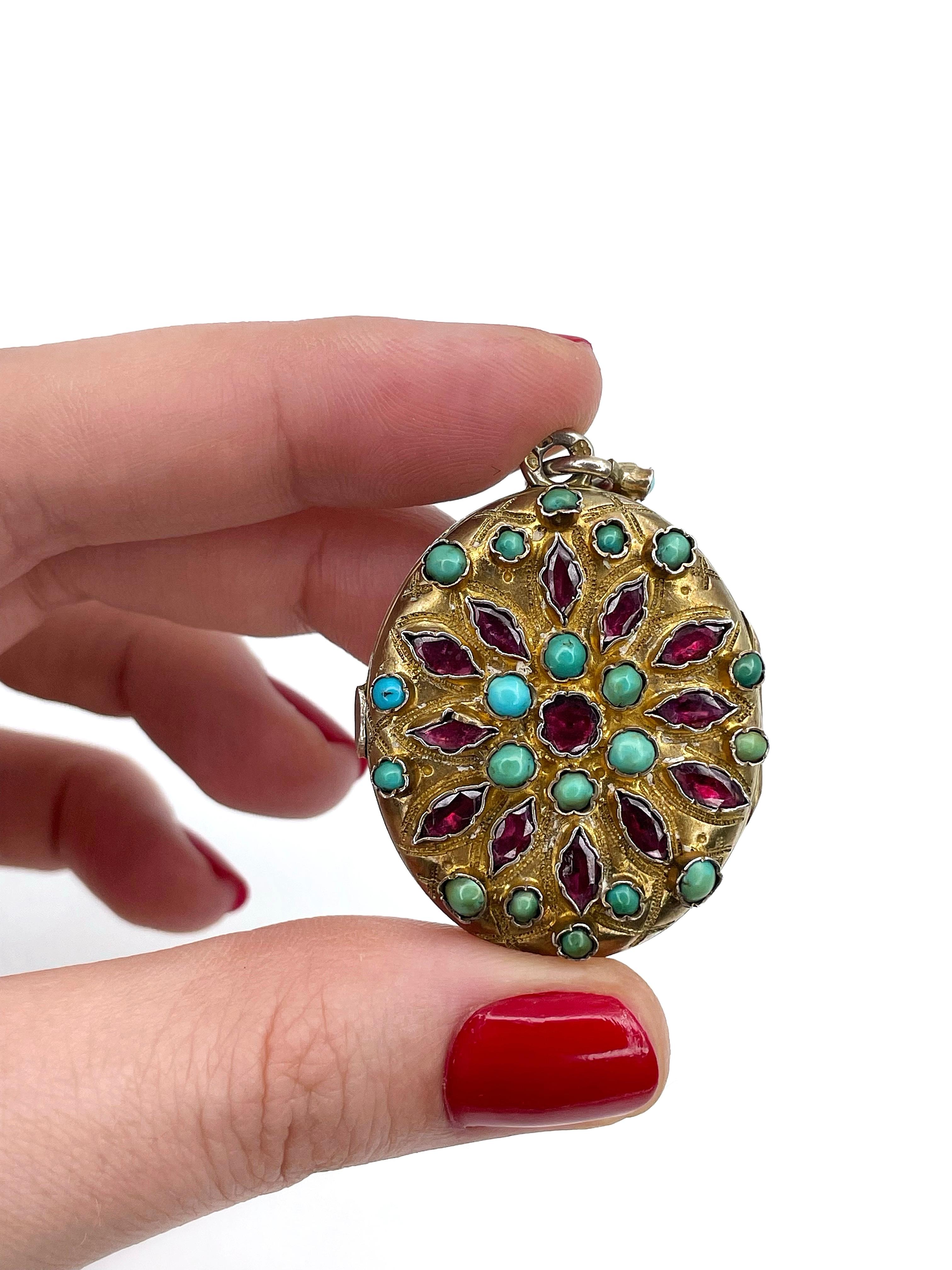 This is a stunning Austro-Hungarian locket pendant designed in Renaissance Revival style. It is crafted in silver and adorned with gold. The piece features beautiful garnets and turquoises. It has two spaces for pictures inside. 

Weight: