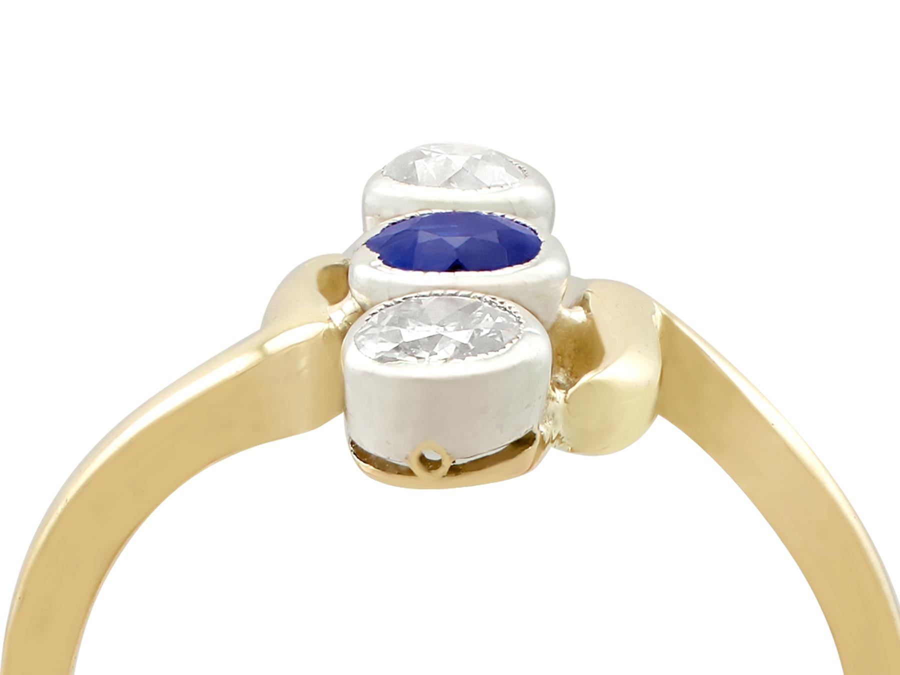 An impressive antique 1930s 0.25 carat sapphire and 0.40 carat diamond, 14 karat yellow gold and silver set twist ring; part of our diverse antique jewelry and estate jewelry collections.

This fine and impressive 1930s sapphire and diamond dress