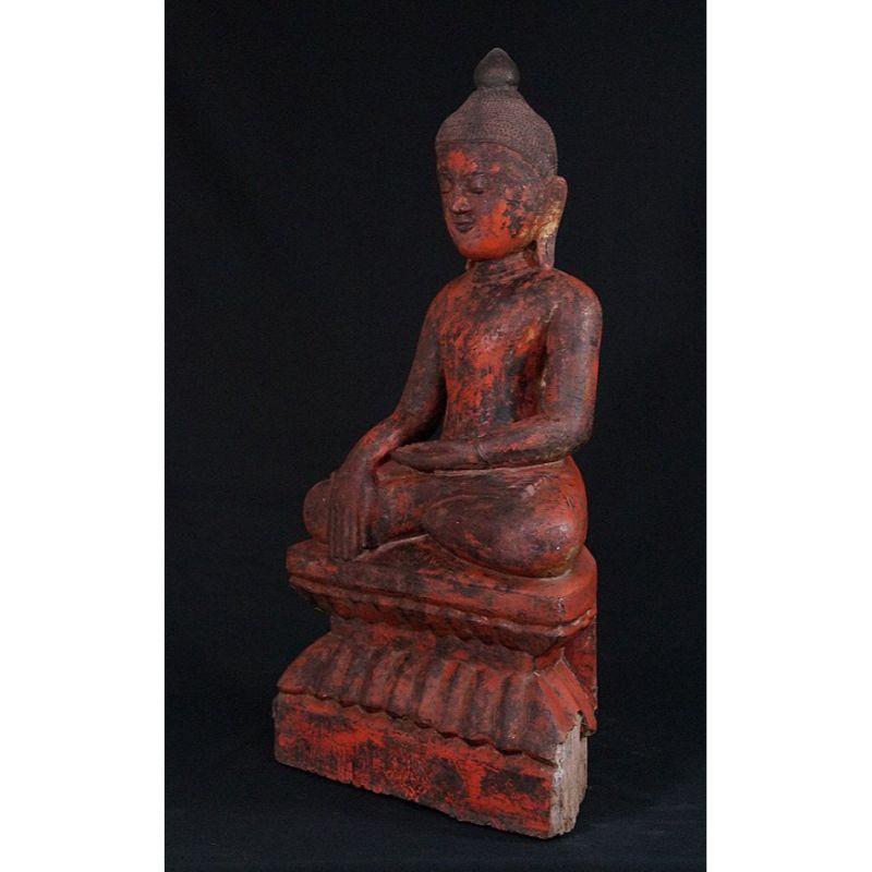 Material: wood
73 cm high 
40,5 cm wide - 19 cm deep
Weight: 10.05 kgs
With remains of the original 24 krt. gildings
Ava style
Bhumisparsha mudra
Originating from Burma
16th century - first Ava period
With Burmese inscriptions in the
