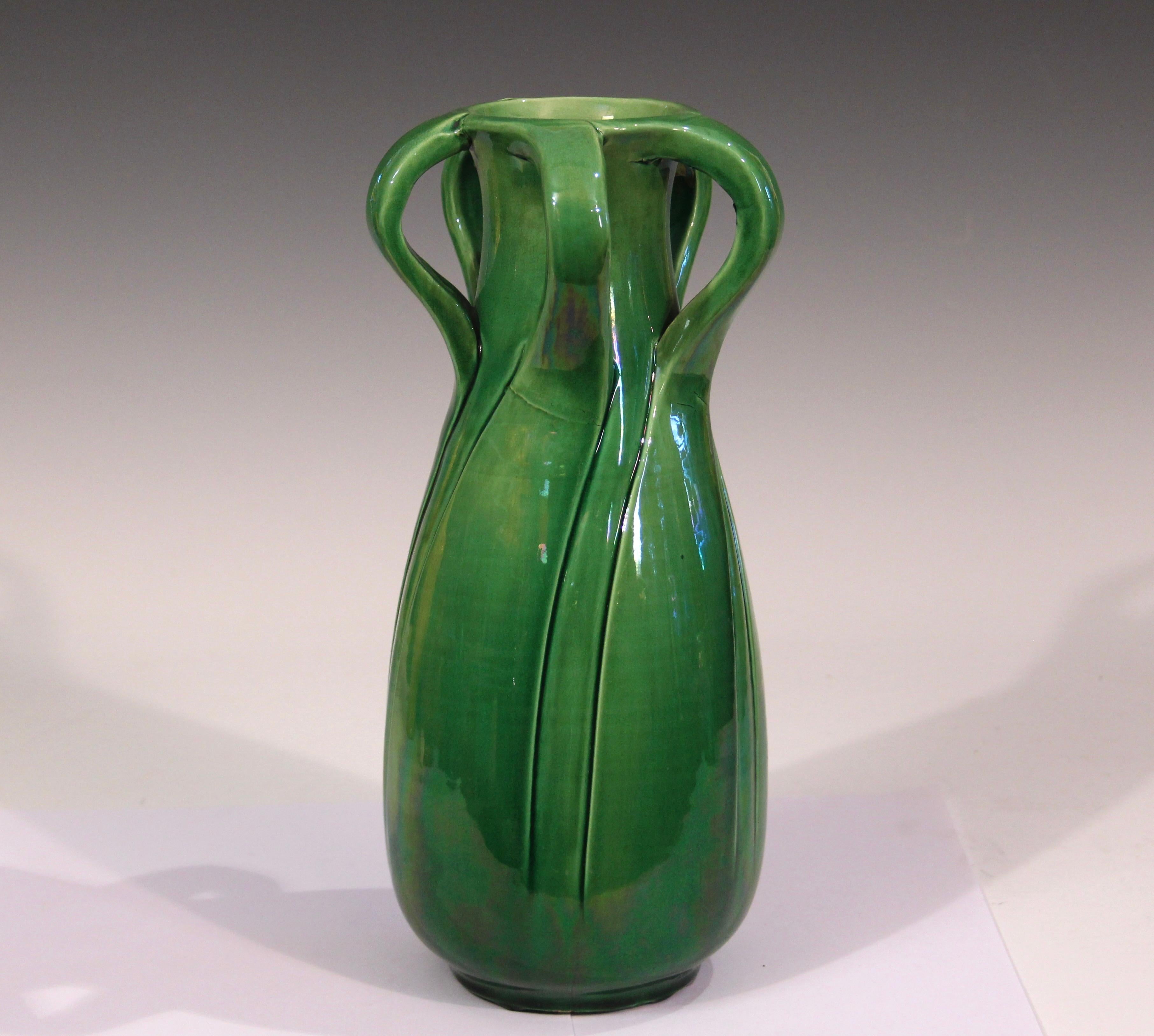 Antique Awaji pottery vase in terrific swirled petal form in green monochrome glaze. Measures: 11 1/2