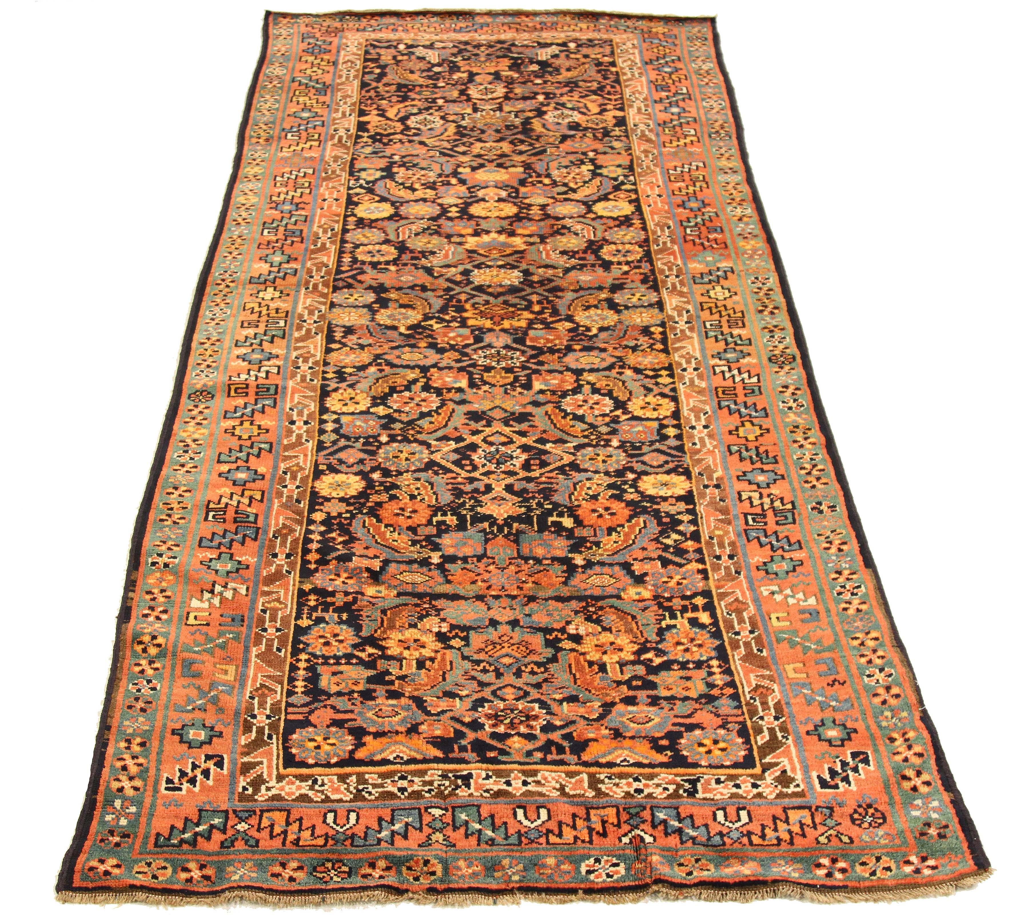 Antique Azerbaijan rug handwoven from the finest sheep’s wool and colored with all-natural vegetable dyes that are safe for humans and pets. It’s a traditional Azerbaijani design featuring mixed floral and geometric details over a brown and black