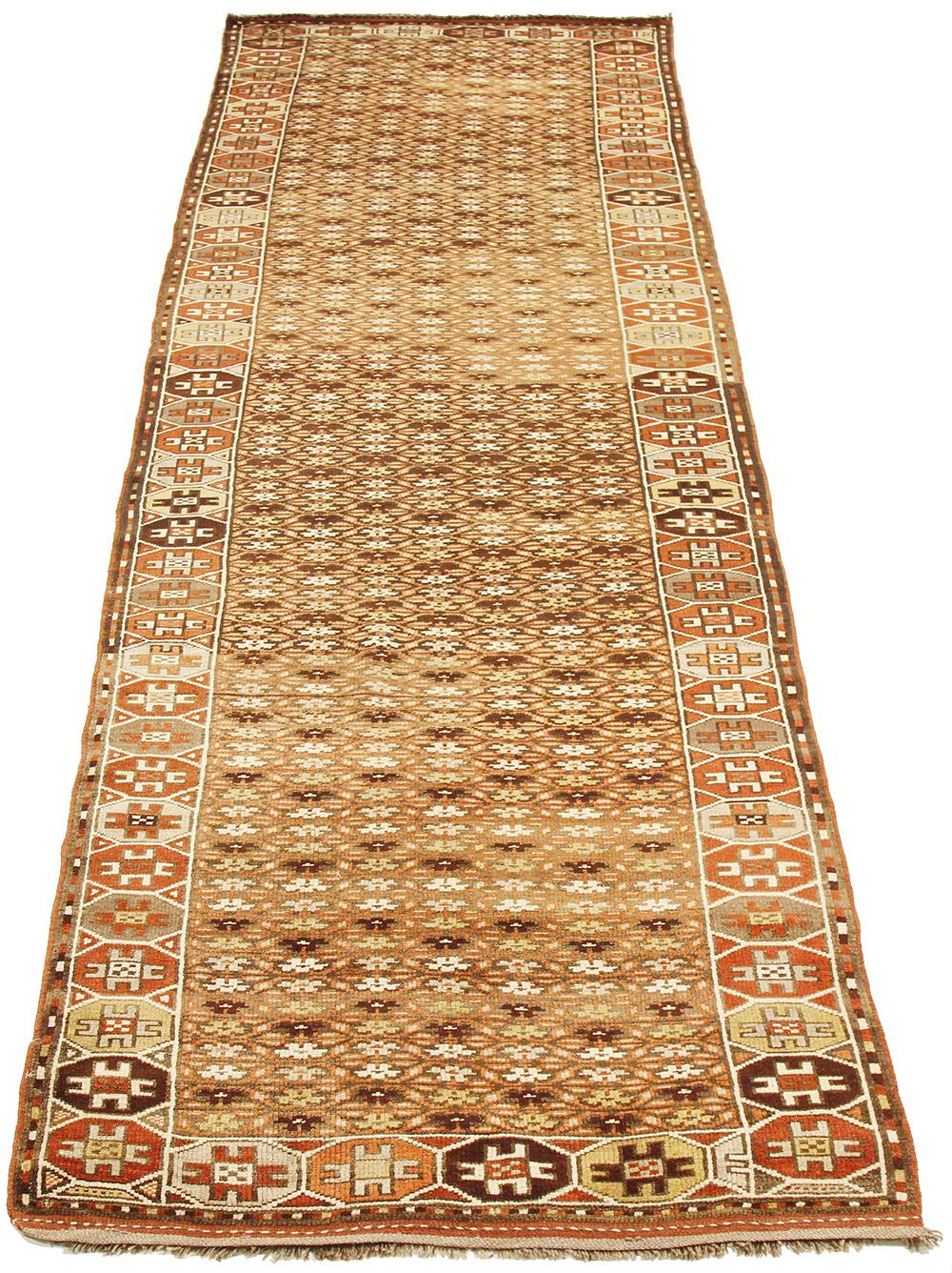 Antique Azerbaijan rug handwoven from the finest sheep’s wool and colored with all-natural vegetable dyes that are safe for humans and pets. It’s a traditional Azerbaijani design featuring mixed floral and geometric details in brown and ivory over