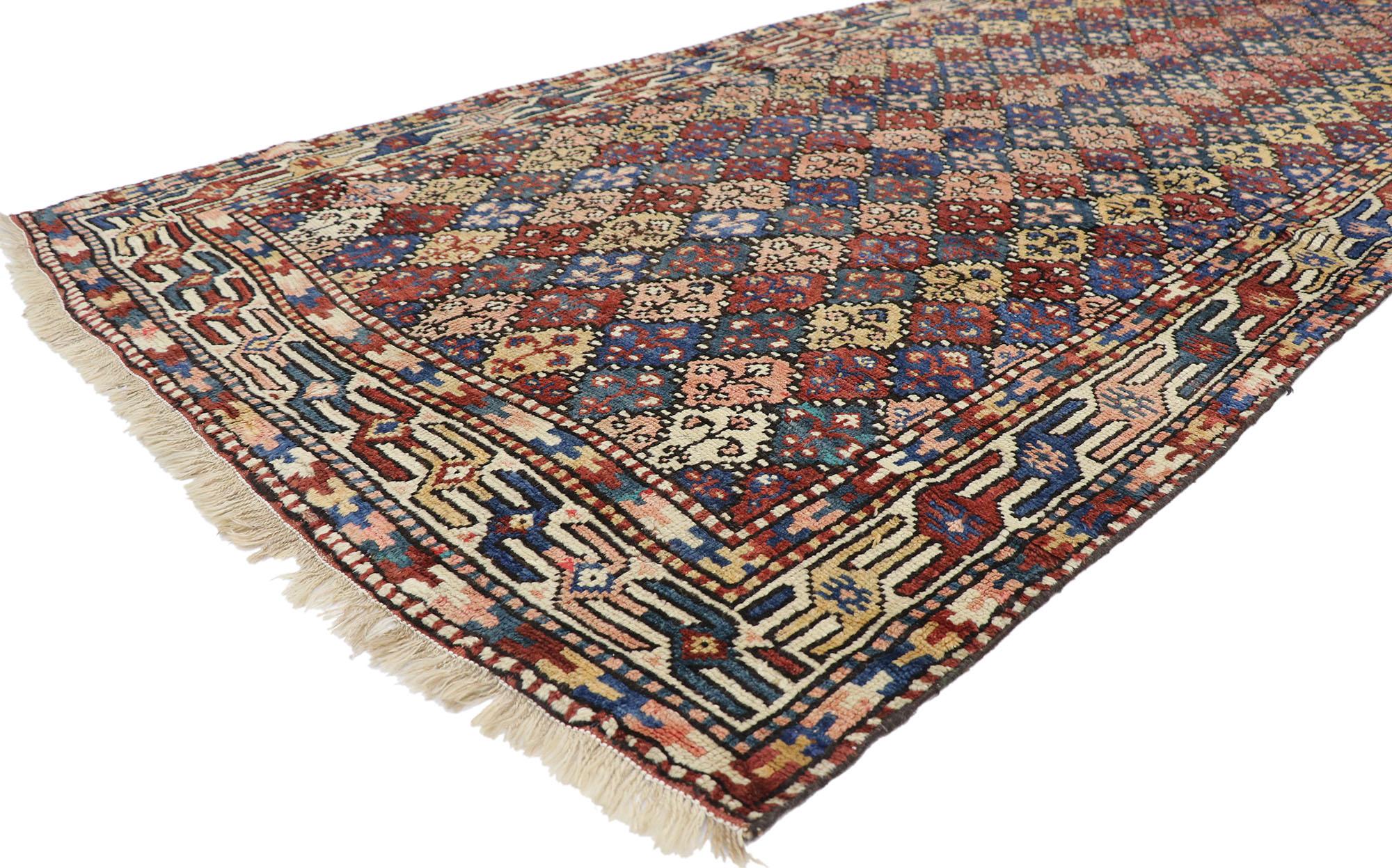 60893 Antique Azerbaijan rug with Mid-Century Modern tribal style 04'05 x 09'09. With its warm hues and rugged beauty, this hand-knotted wool antique Azerbaijan rug beautifully embodies a Mid-Century Modern tribal style. The abrashed field features