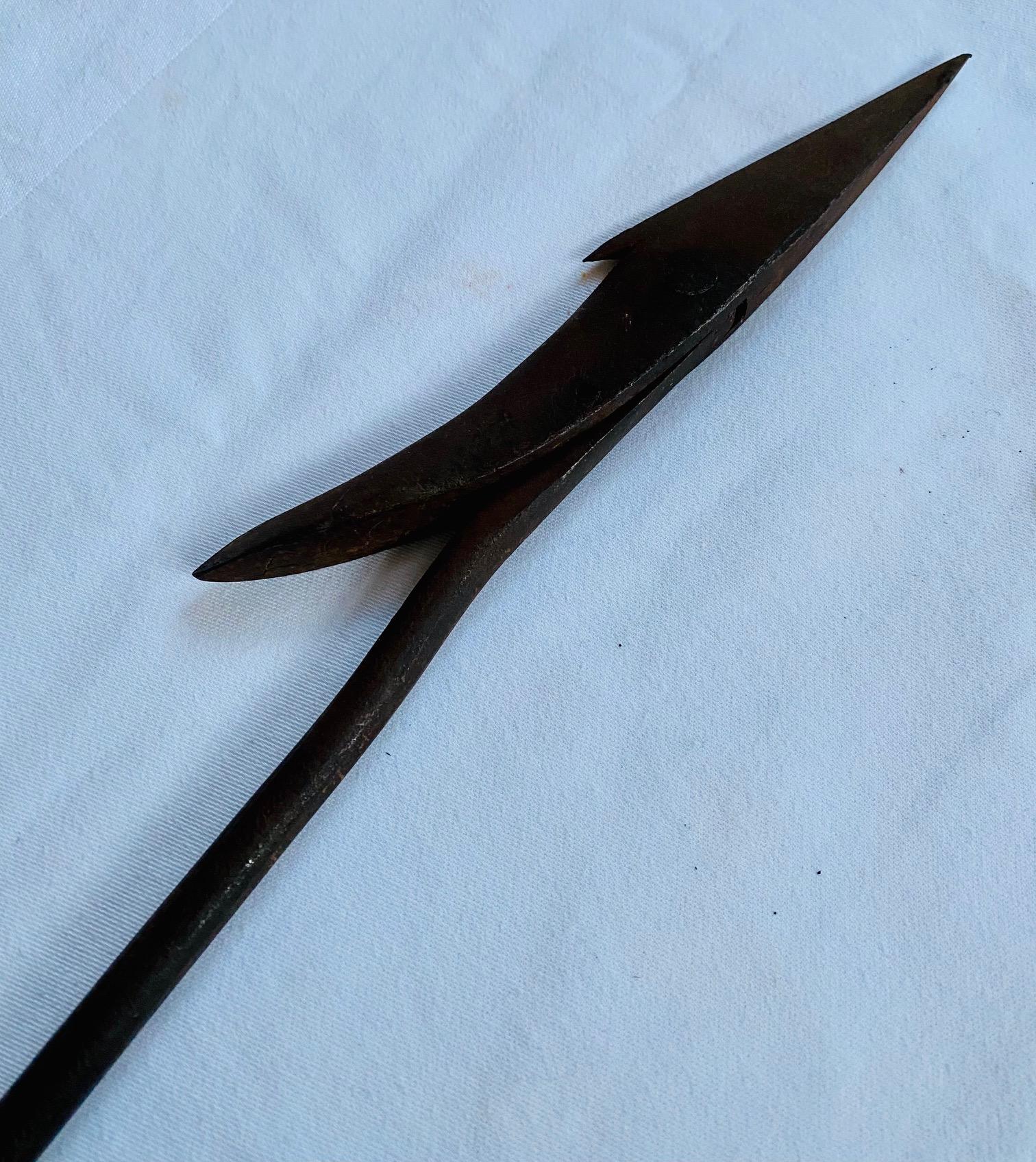 Antique Azorean or Madeiran Improved Toggle Iron Harpoon, early 20th century, having a low profile racy 7-1/4 inch long toggle head with sharply acute barbed cutting edge and up-swept rear barb, pivoting on flatted boss, on 3/8 inch diameter shank