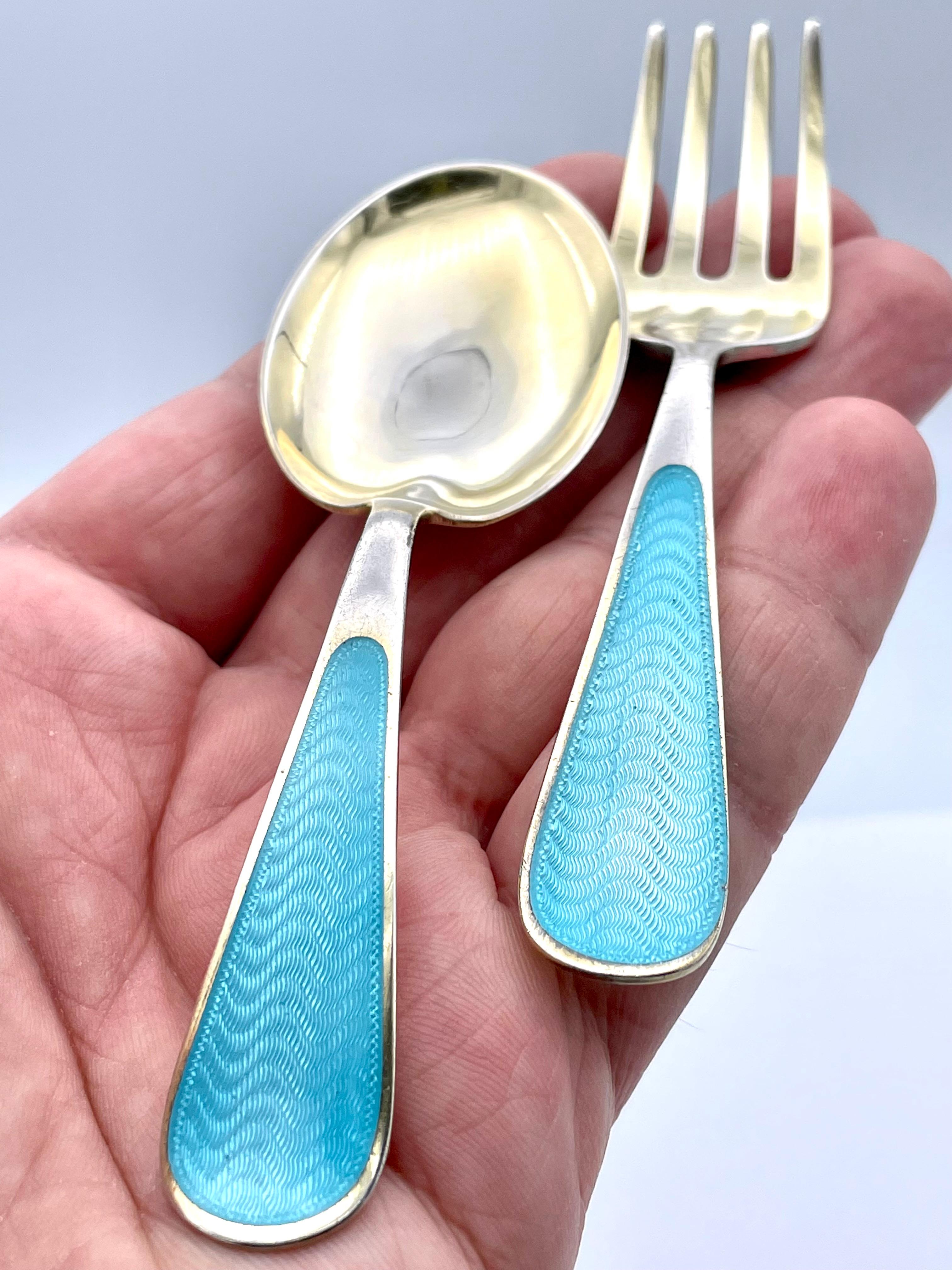 For the baby boy who has everything -- a beautiful antique first spoon and fork set.  Sterling silver with pristine blue guilloche enamel handles.  Heavy gauge silver.  
A perfect gift.

Alice Kwartler has sold the finest antique gold and diamond