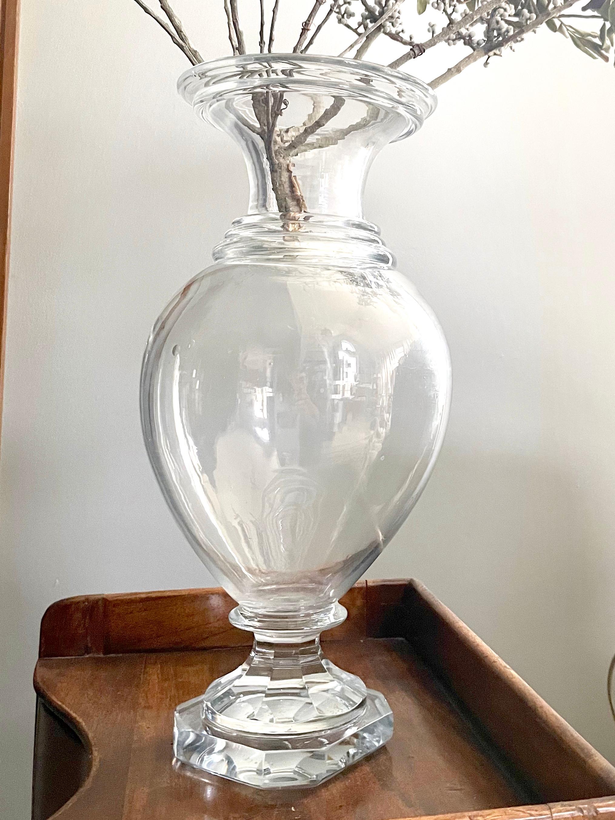 Antique Bacarat crystal vase. Baluster form neoclassical style tall French crystal vase with banded neck and rim with thick cut octagonal form base. France 1840’s
Dimensions:15.25” H x 7” diameter body; 6.38” diameter top & 4.38” diameter base.