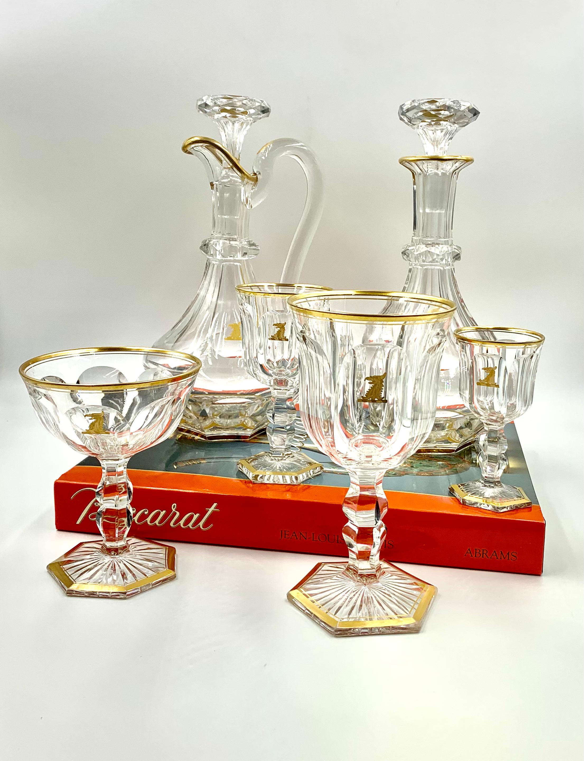 Historically significant Baccarat Empire Simson Armorial Crest stemware service for 8 - champagne, wine, water and liqueur glasses and two superb wine decanters, each piece bearing the Simson crest
19th Century
The Armorial crest is almost certainly