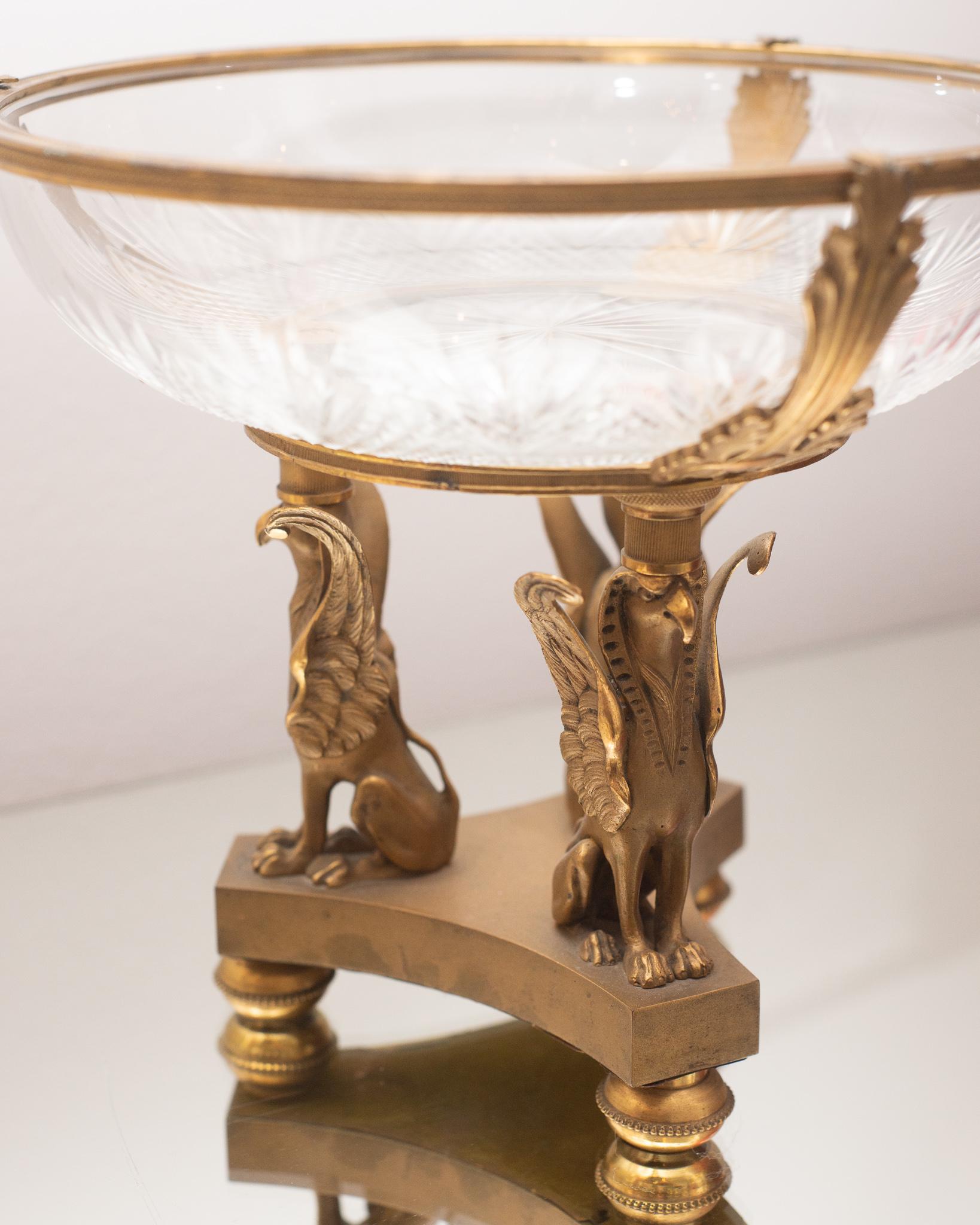 An Antique Baccarat cut crystal bowl, held up with 3 griffin mounts on a bronze pedestal, circa 1900, this beautiful piece is unsigned; the quality of the workmanship speaks to the skill of the maker.