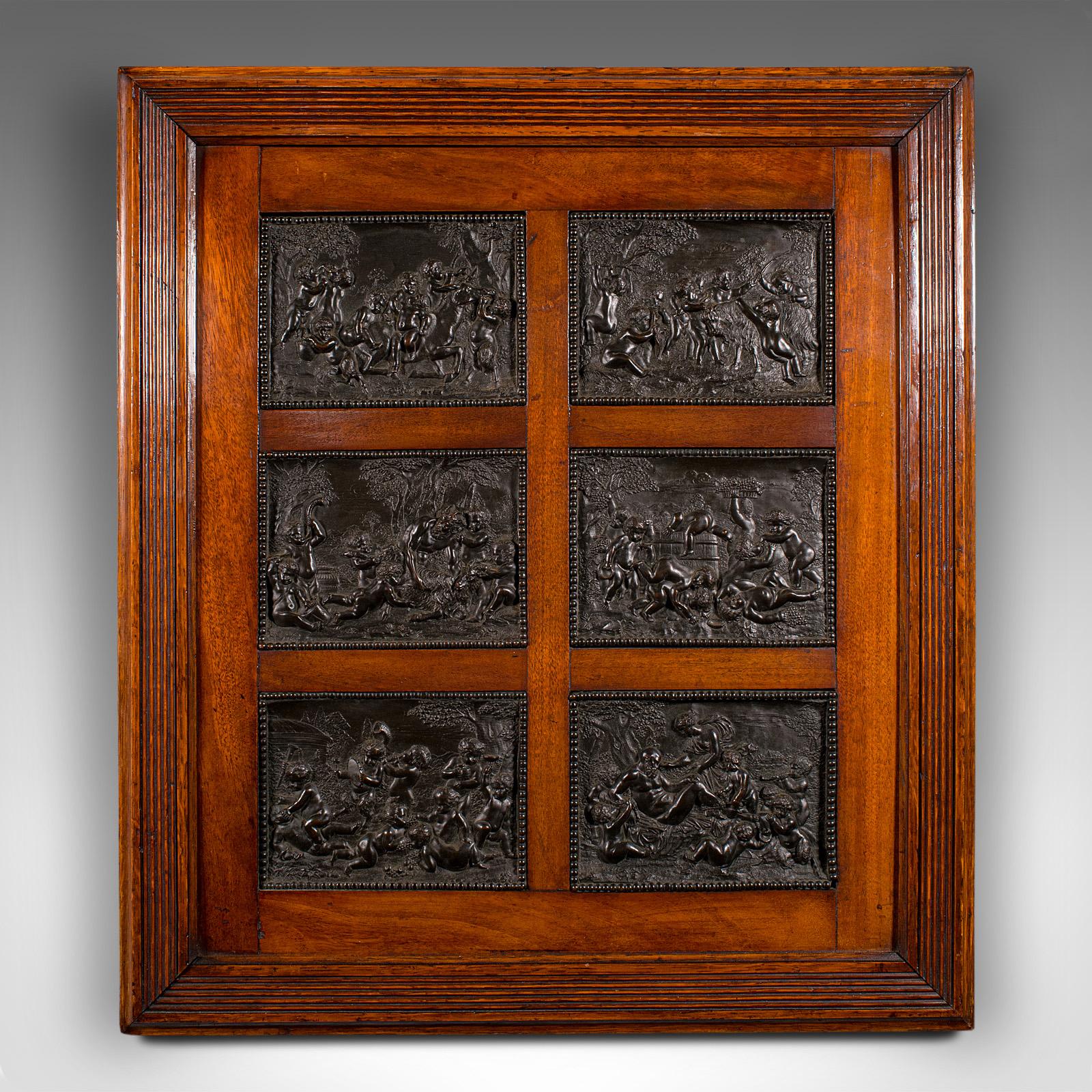 This is an antique framed Bacchanalian Frieze. An Italian, mahogany and bronze Grand Tour relief mount after François Duquesnoy (1594-1646), dating to the early Victorian period, circa 1850.

Delightful 19th century relief work in the manner of