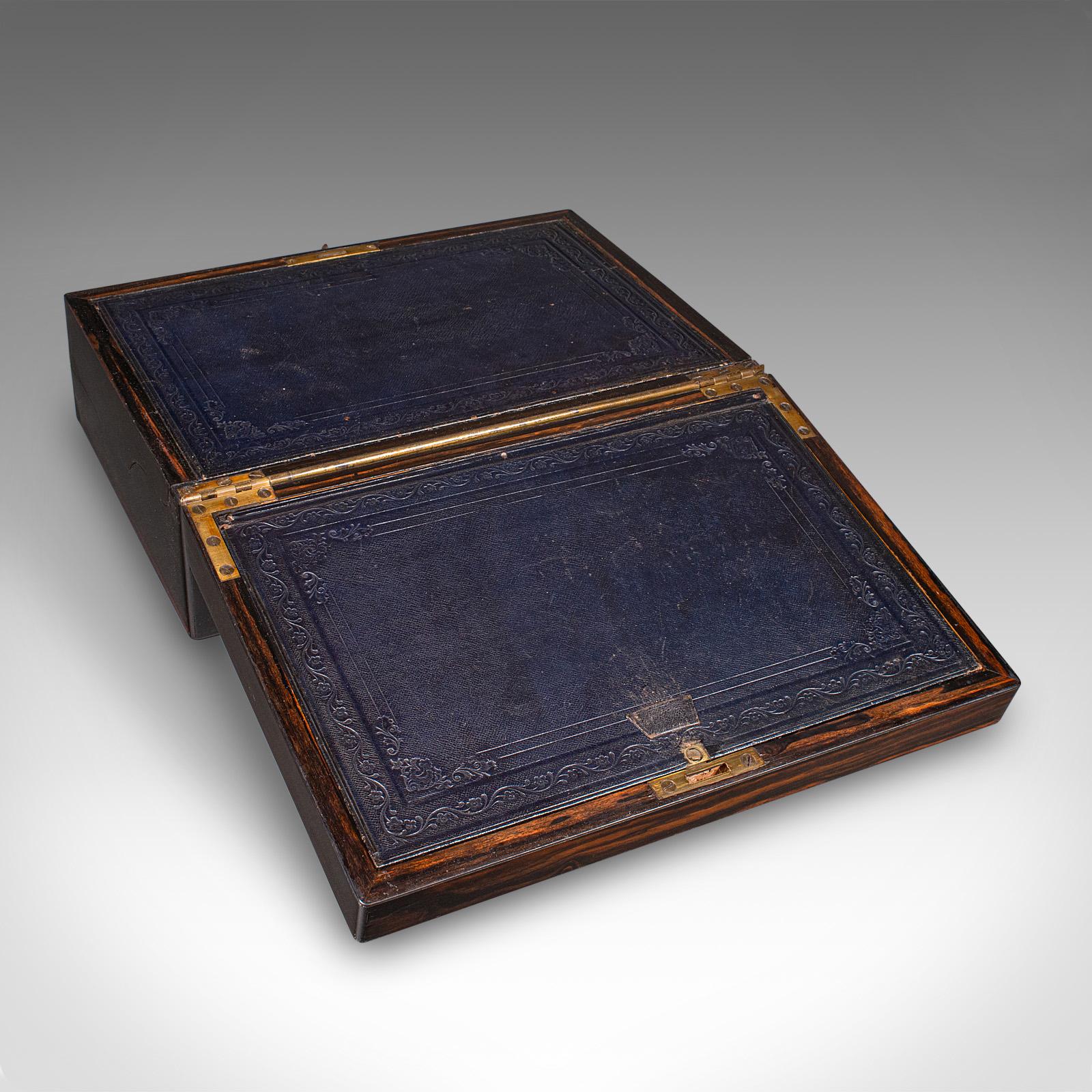 This is an antique bachelor’s writing slope. An English, coromandel and satinwood correspondence box dating to the Regency period, circa 1830. A superior example of portable desk furniture, showcasing striking casework and a fine fitted