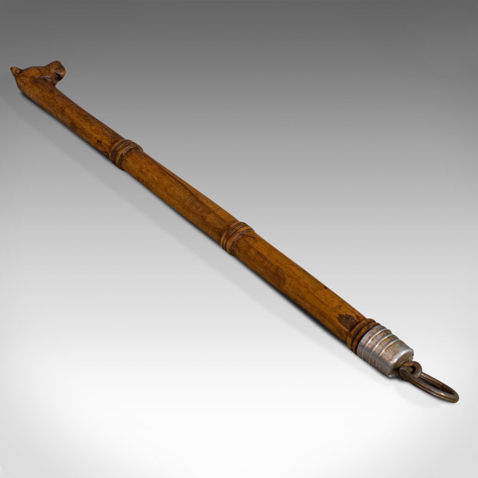 This is an antique back scratcher. An English, bamboo-ised beech treen with dog motif, dating to the Regency period, circa 1820.

Displays a desirable aged patina
Beech in caramel hues with fine grain interest
Bamboo-ised finish adds further