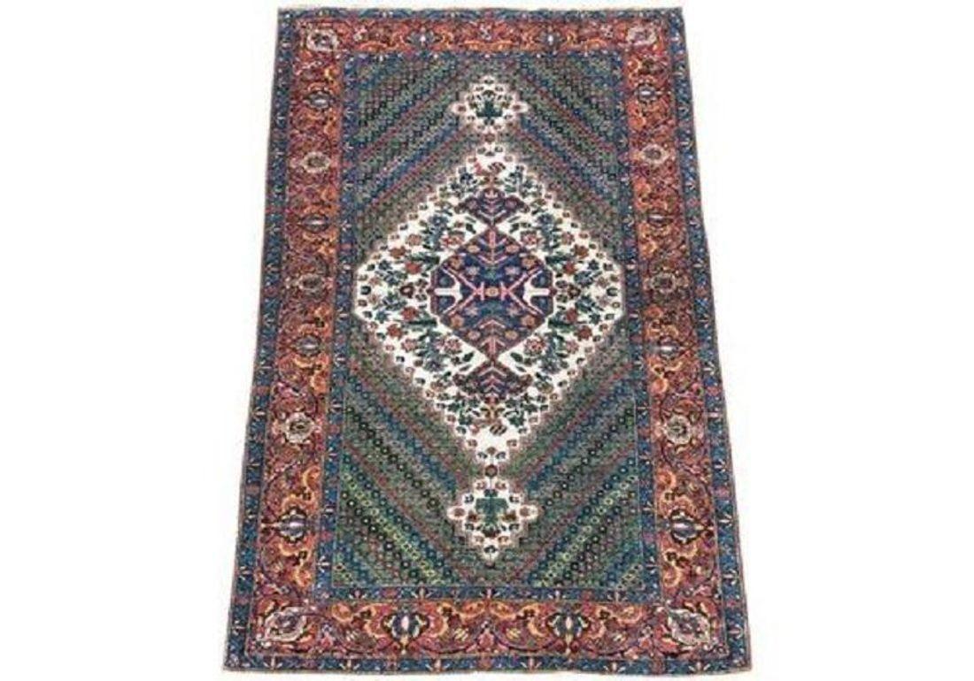 A fabulous antique Bakhtiar rug, handwoven circa 1910 with a large lozenge medallion on a ‘mille fleurs’ (thousand flowers) field and terracotta border. Lovely wool quality and stunning colours!

Size: 2.05m x 1.37m (6ft 9in x 4ft 6in)
This rug is