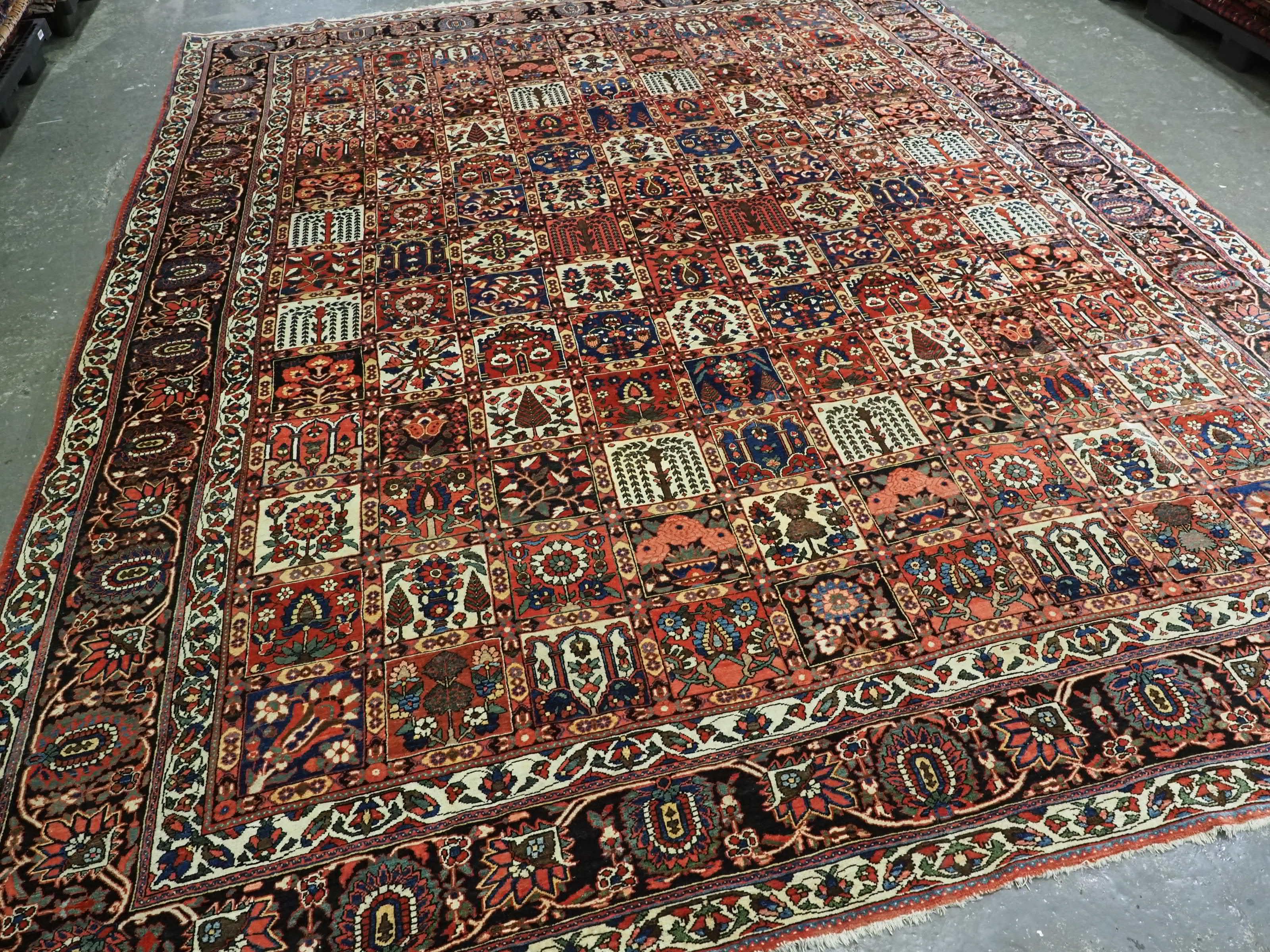 
Size: 13ft 8in X 10ft 11in. (416 X 333cm).

Antique Persian Bakhtiari carpet of the 'garden' design.

Circa 1900.

An outstanding example of a garden carpet with each compartment containing a different tree or flower. The carpet has a wonderful
