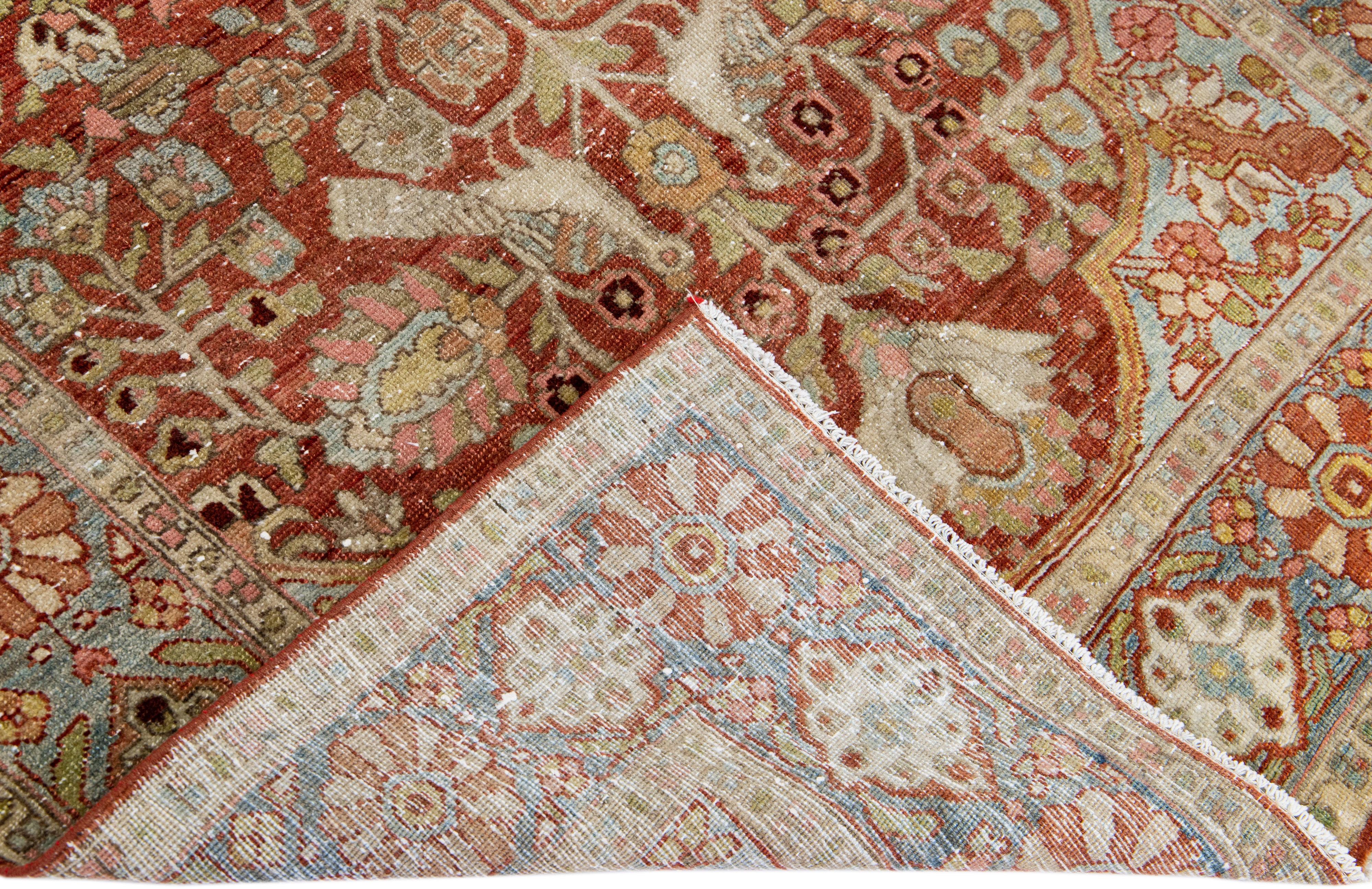 Beautiful antique Bakhtiari hand-knotted wool rug with a red field. This piece rug has a blue frame with multicolor accents on a gorgeous classic multi medallion floral design

This rug measures 4'8