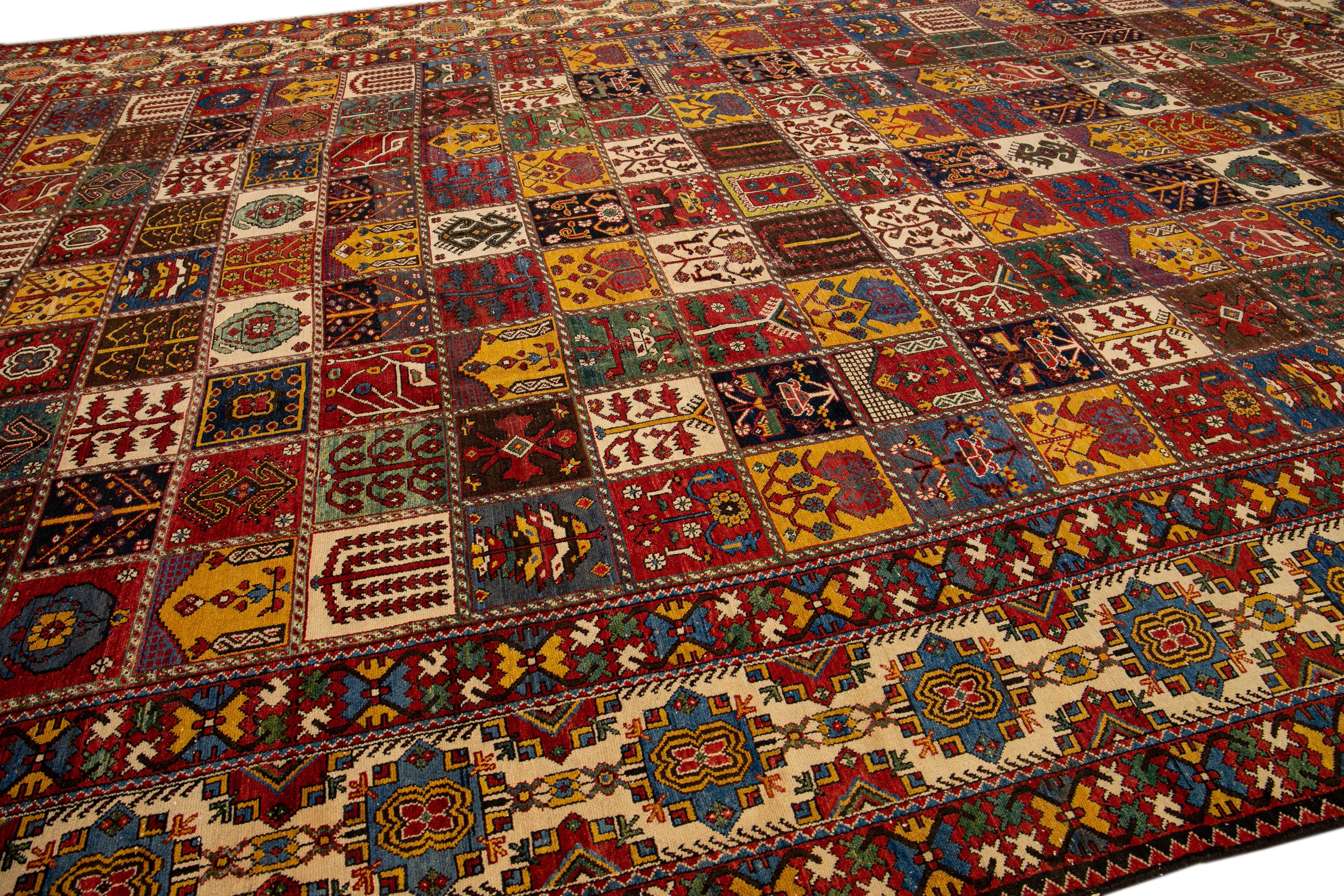 Antique Bakhtiari Persian Handmade Multi Designed Red Oversize Wool Rug For Sale 1