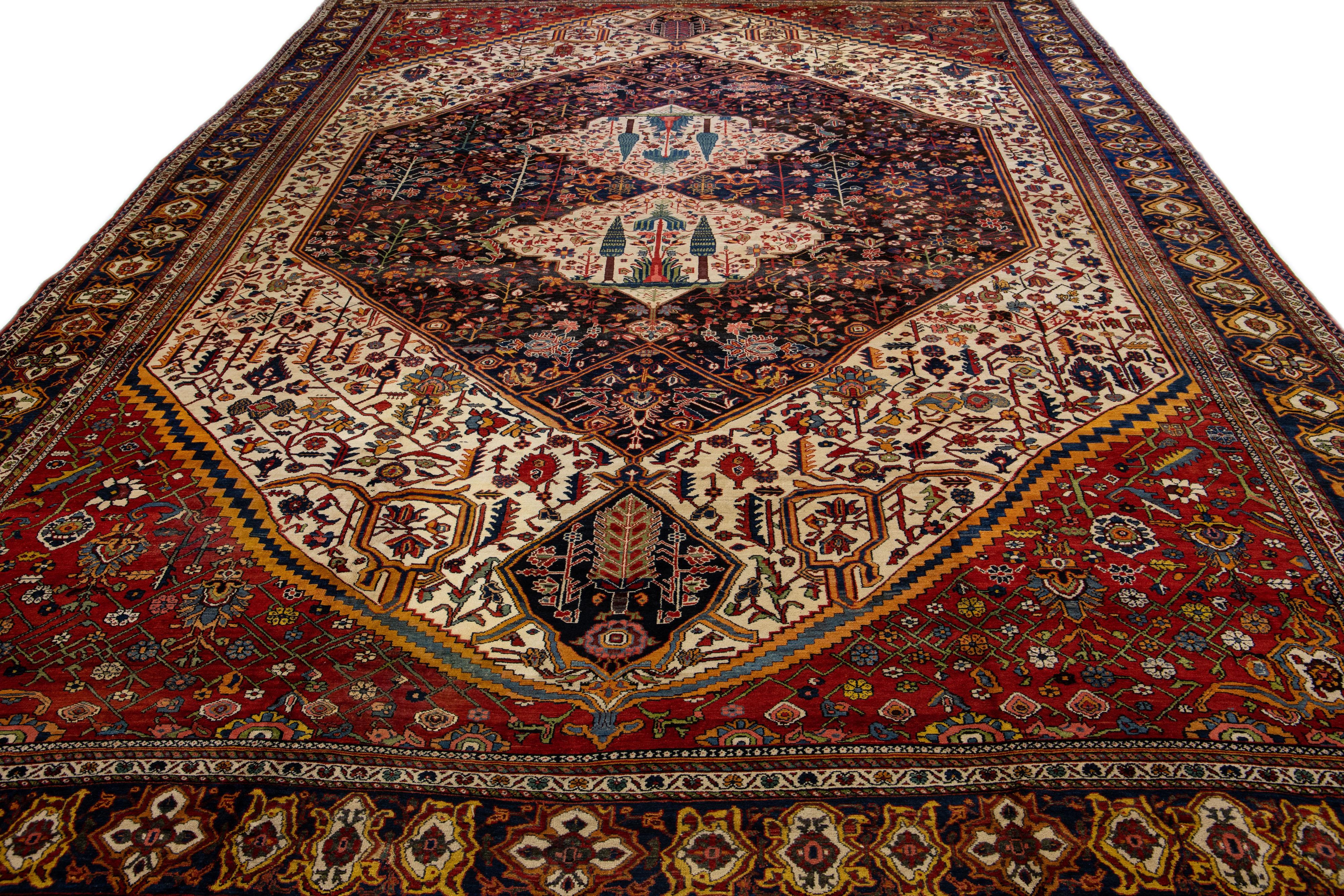 Bakshaish Antique Bakhtiari Persian Handmade Red and Blue Floral Oversize Wool Rug For Sale