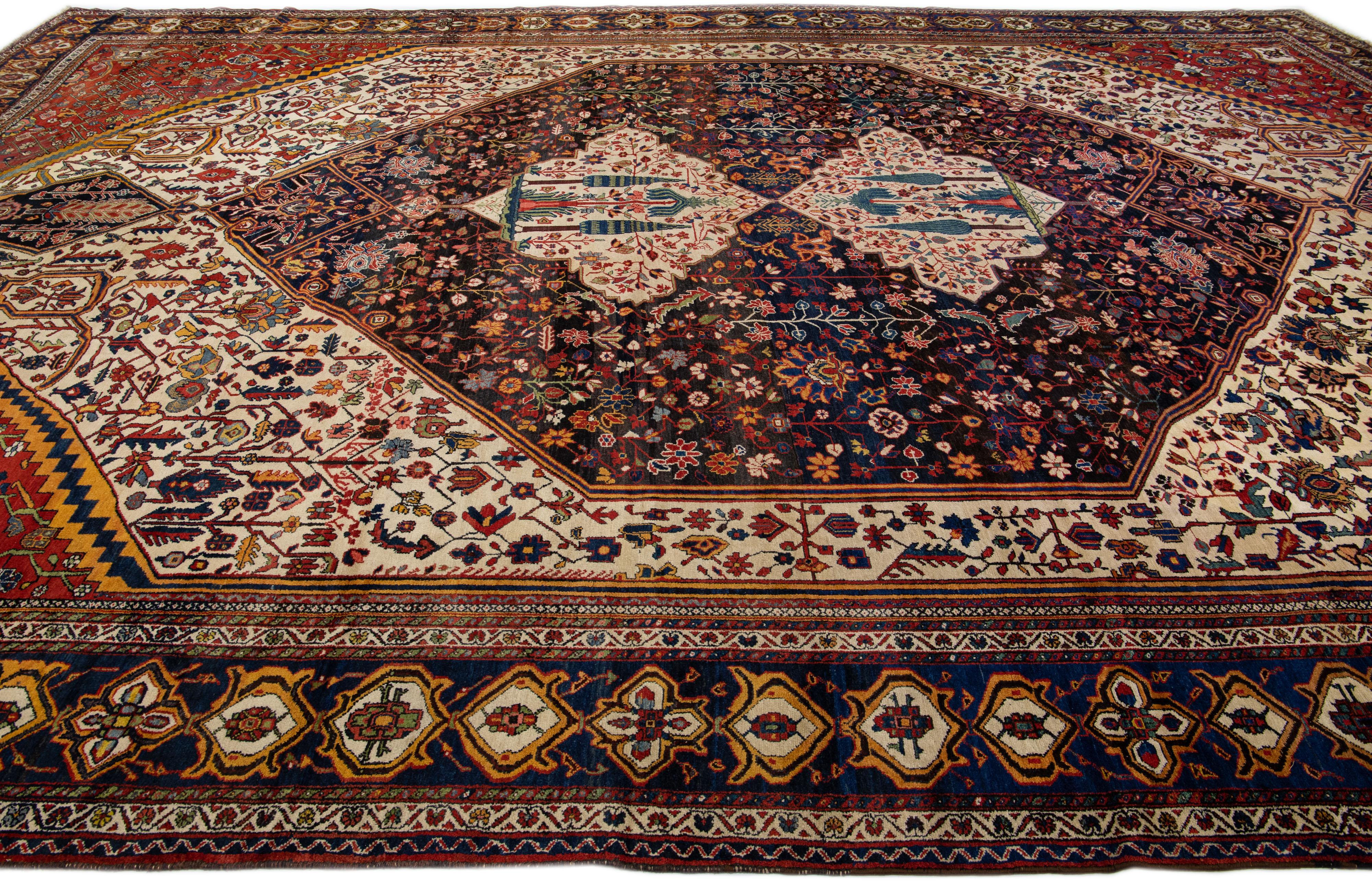 Antique Bakhtiari Persian Handmade Red and Blue Floral Oversize Wool Rug In Excellent Condition For Sale In Norwalk, CT