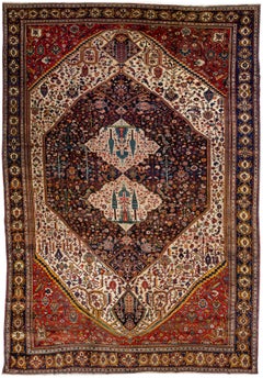 Tapis persan Bakhtiari ancien en laine à fleurs rouges et bleues surdimensionnées, fait à la main