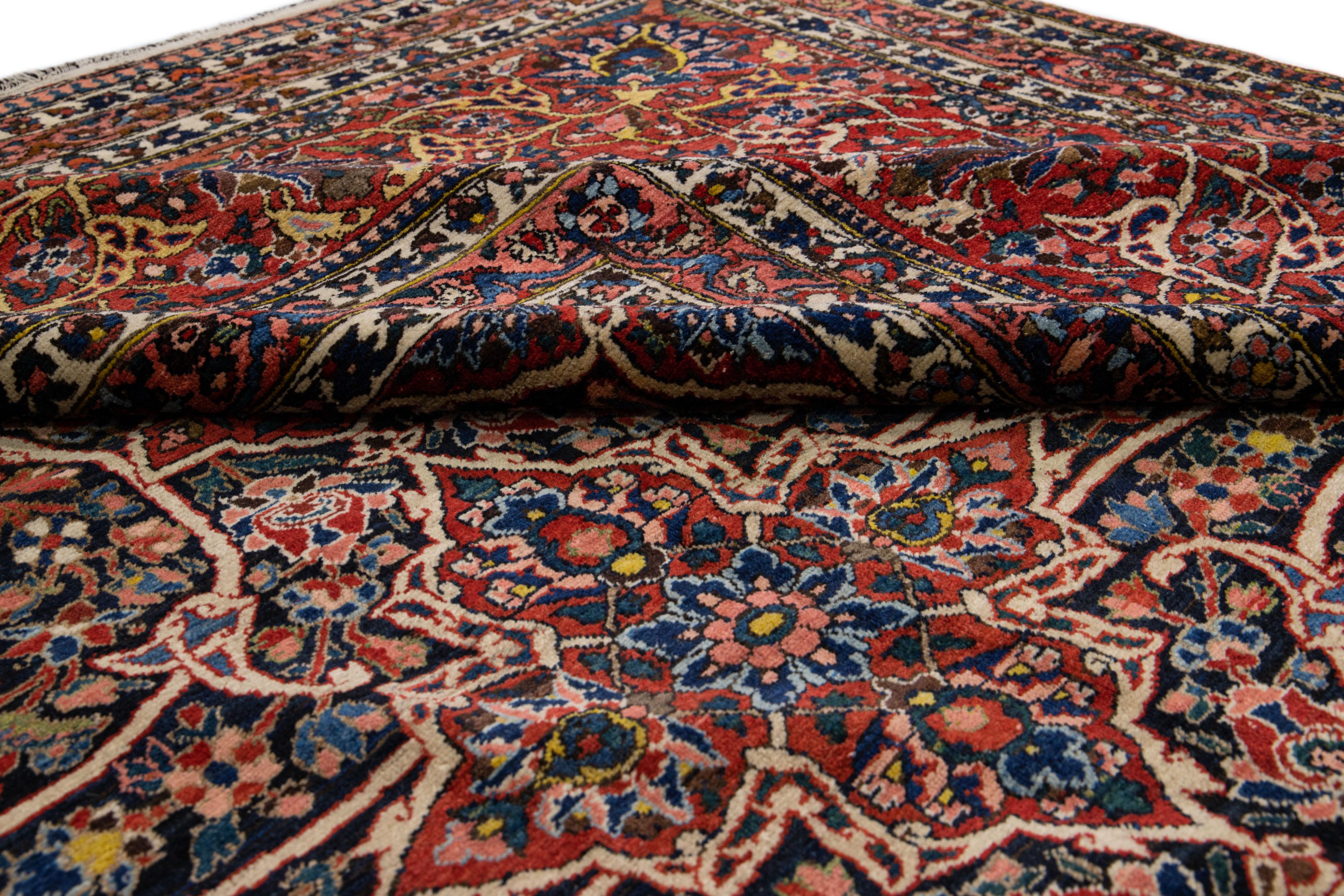 20th Century Antique Bakhtiari Persian Handmade Red & Blue Wool Rug With Floral Pattern For Sale