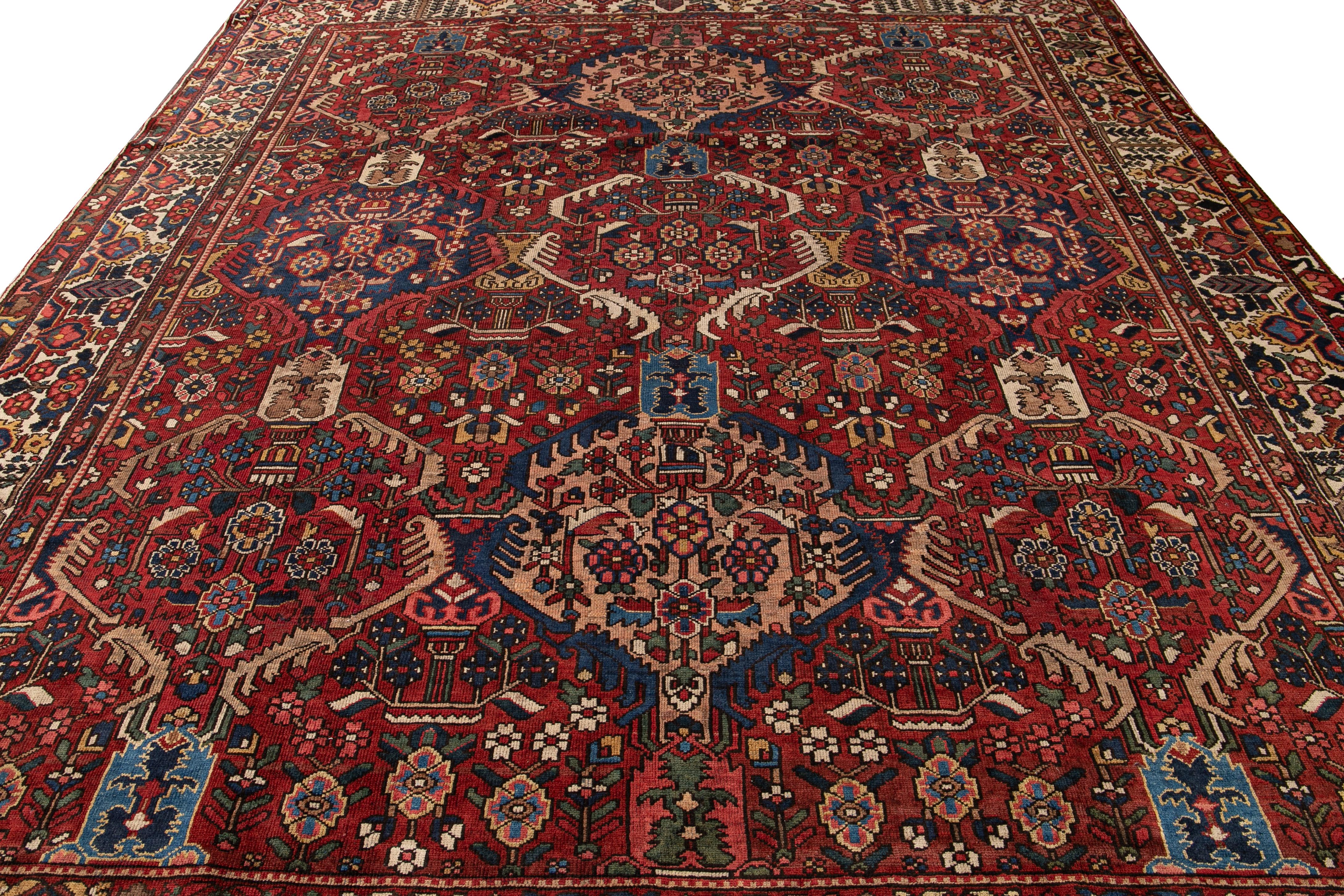 Bakshaish Antique Bakhtiari Persian Handmade Red Floral Wool Rug For Sale