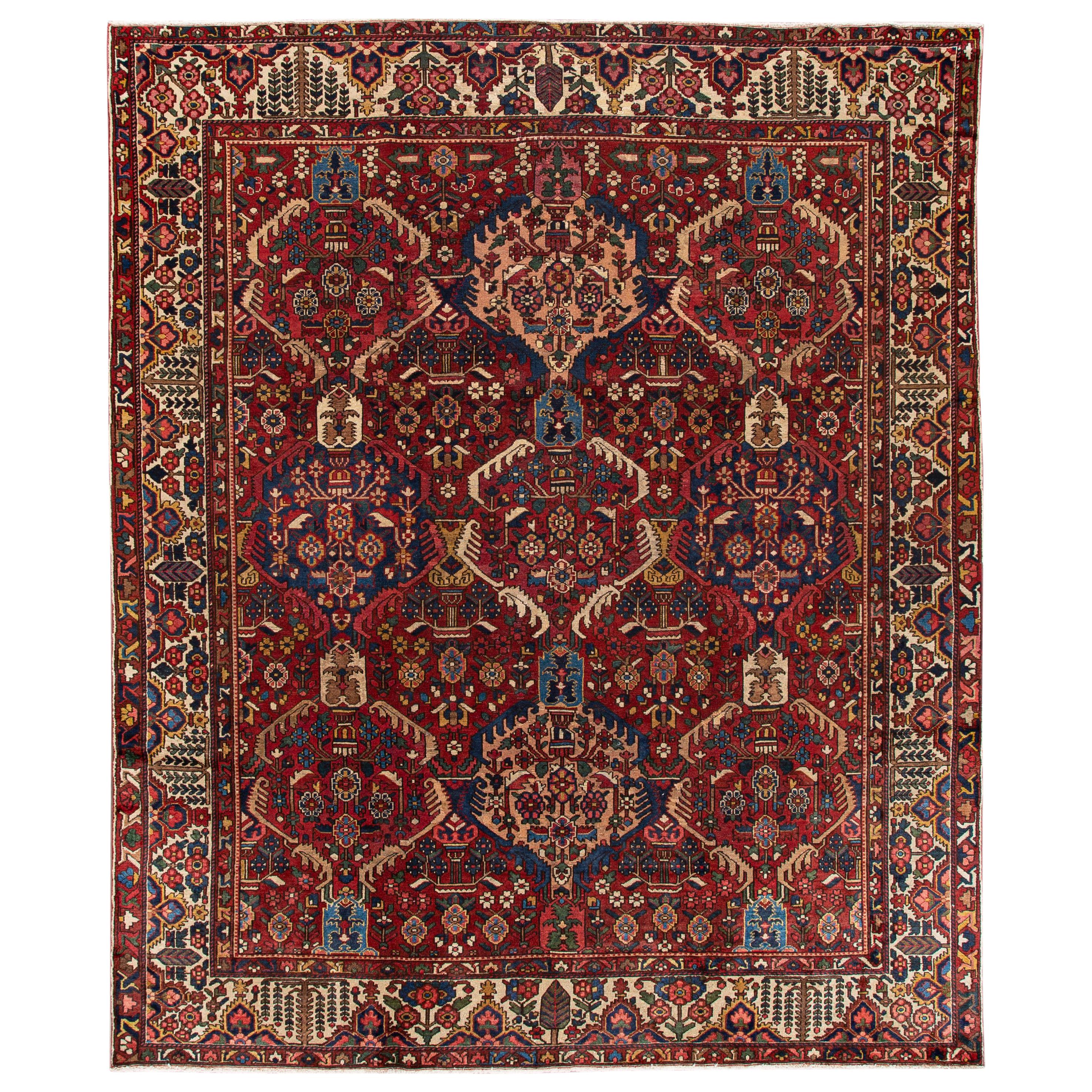 Tapis persan ancien Bakhtiari en laine rouge à fleurs, fabriqué à la main