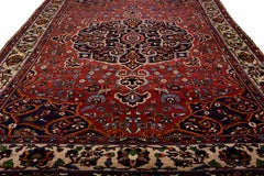 20th Century Red Handmade Bakhtiari Wool Rug With Rosette Motif