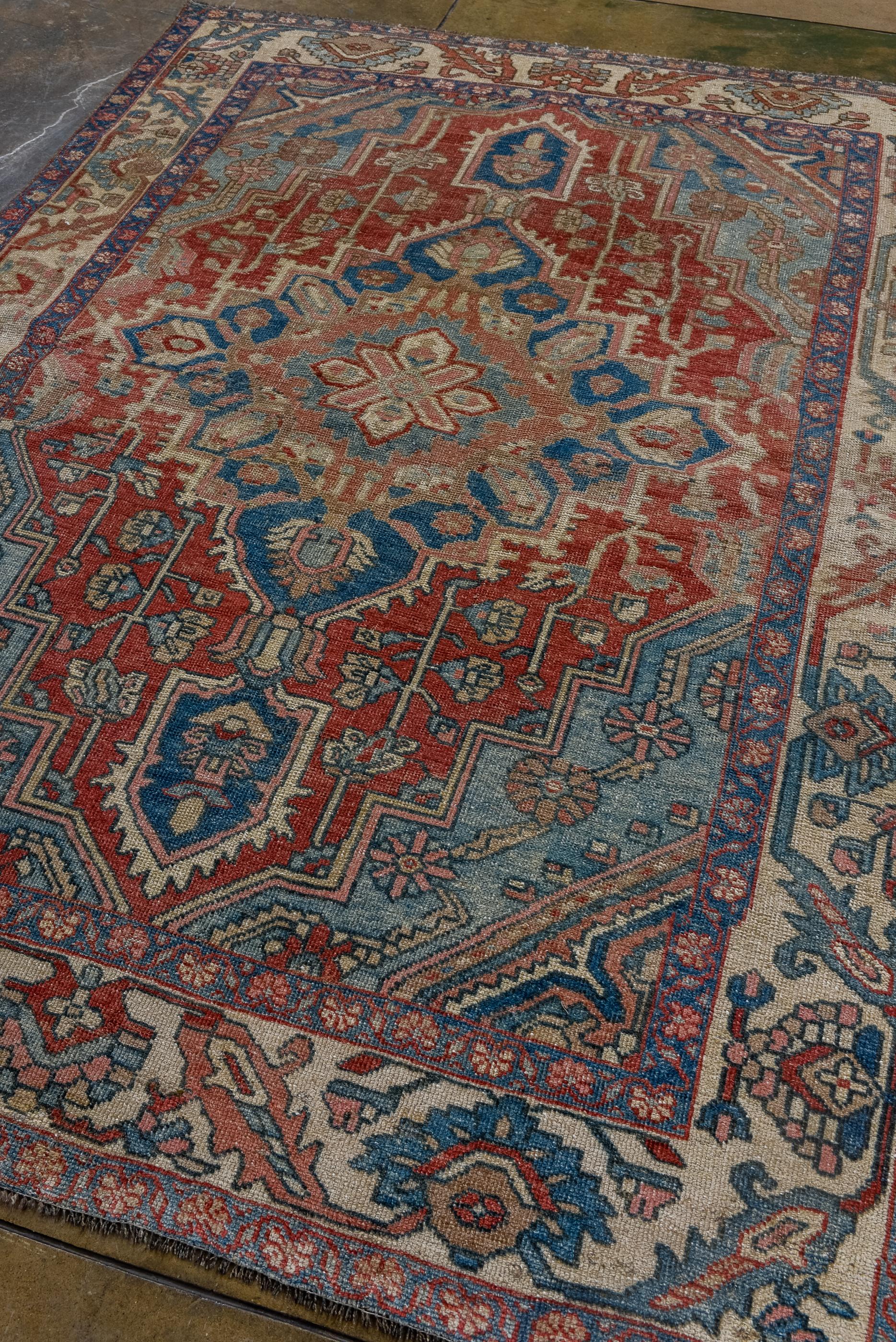 Persian Antique Bakhtiary with Red Field and Shades of Blue Details, Circa 1920's For Sale
