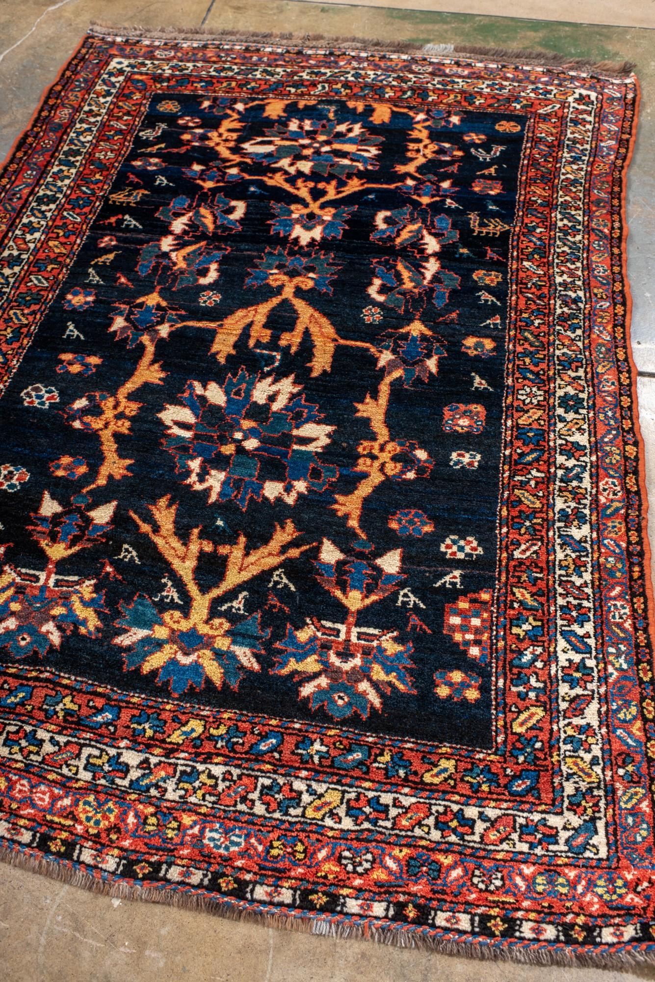Persian Antique Baktiary Rug with Floral Design For Sale