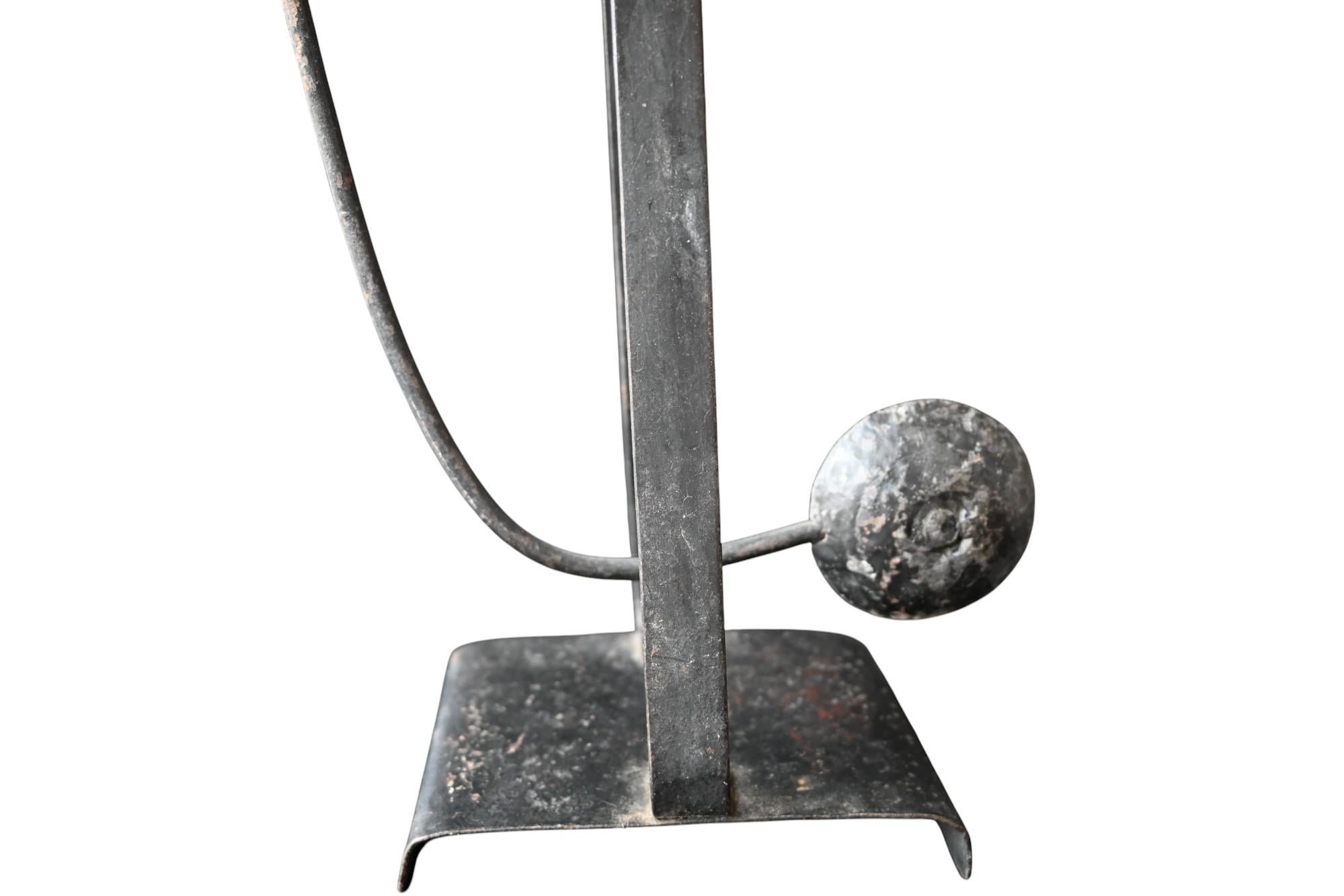 An antique balance toy showing a cowboy on it's horse
when it balance is the head and tale of the horse moving like also the cowboy
This is totale handforged iron and handpainted (original paint) aged patina
Dating from the end of the 19th century
