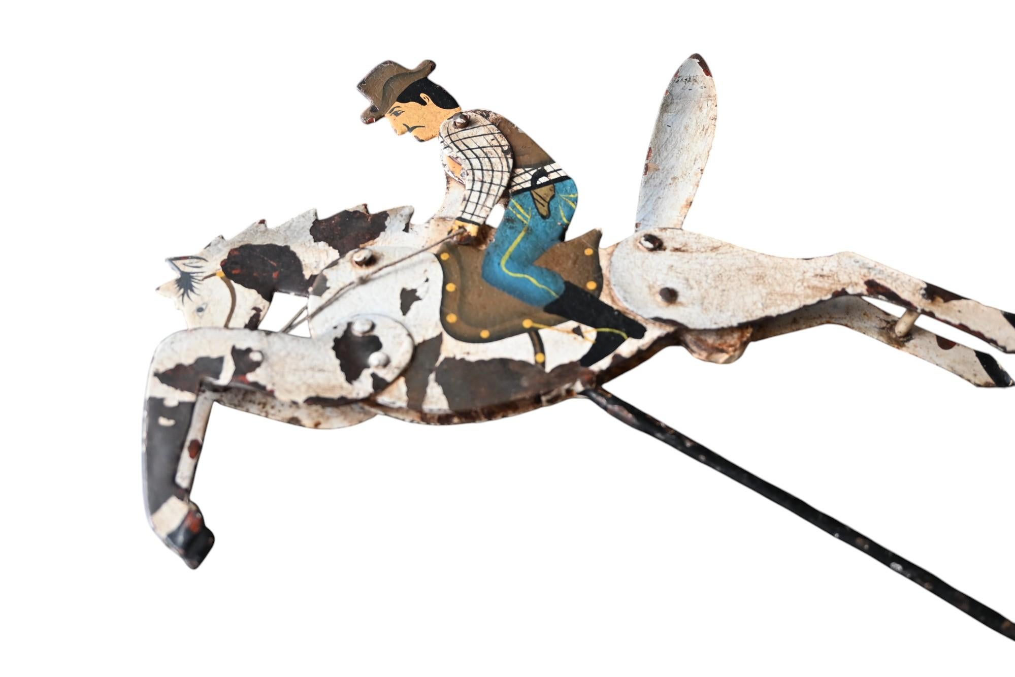 Antique balance toy Galloping Cowboy Moving , handpainted forged iron, 19th C. For Sale 1