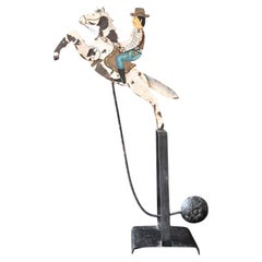 Antique balance toy Galloping Cowboy Moving , handpainted forged iron, 19th C.