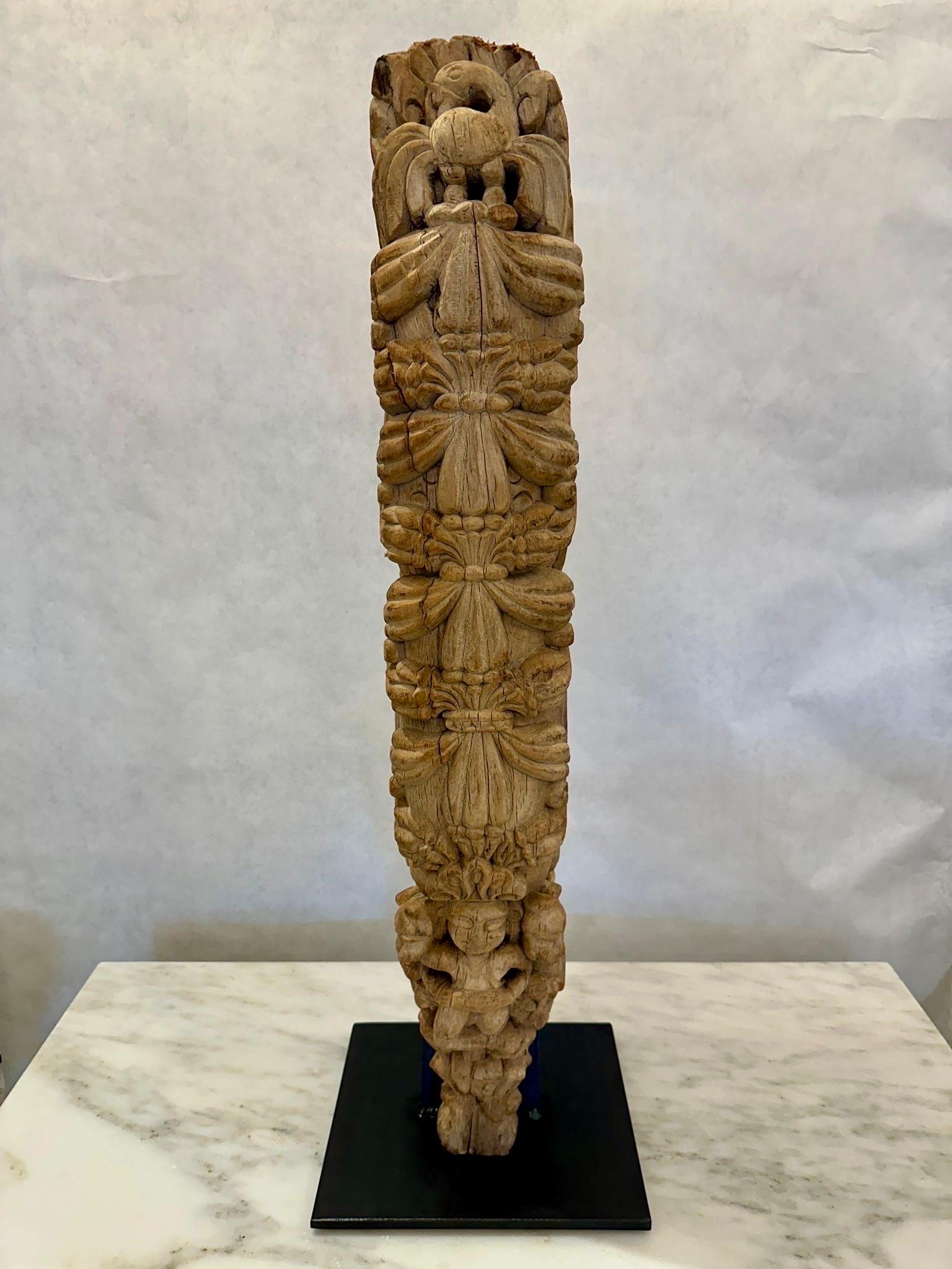 This roof mounted decorative element was salvaged from a 19th C. Balinese building and we had it professionally mounted on an iron display base so as to highlight its amazing carvings and details.  NOTE: THIS ITEM IS LOCATED AND WILL SHIP FROM OUR