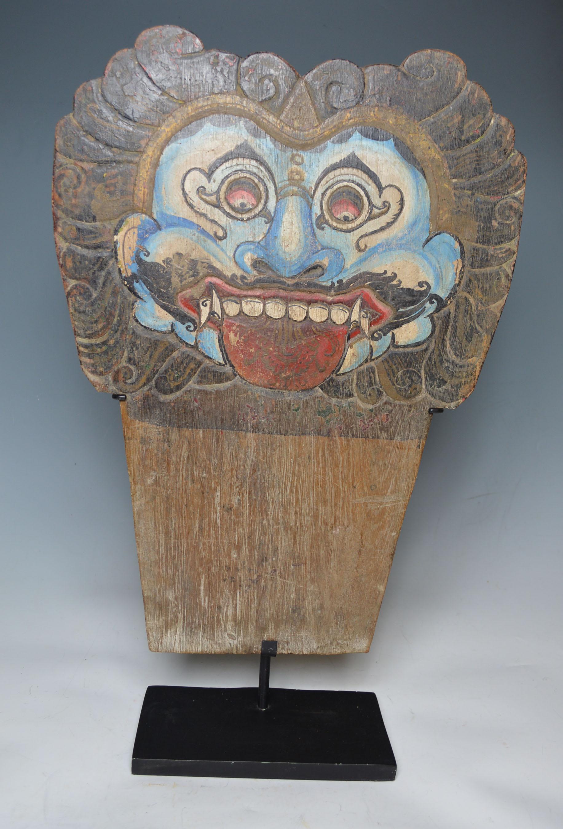 A fine Pair antique carved and painted wood panel of the Balinese demon queen Rangda, 
Part of a processional Barong Dance costume
Used during Barong dances and ceremonies celebrating the battle between Rangda and Barong which roughly equates to