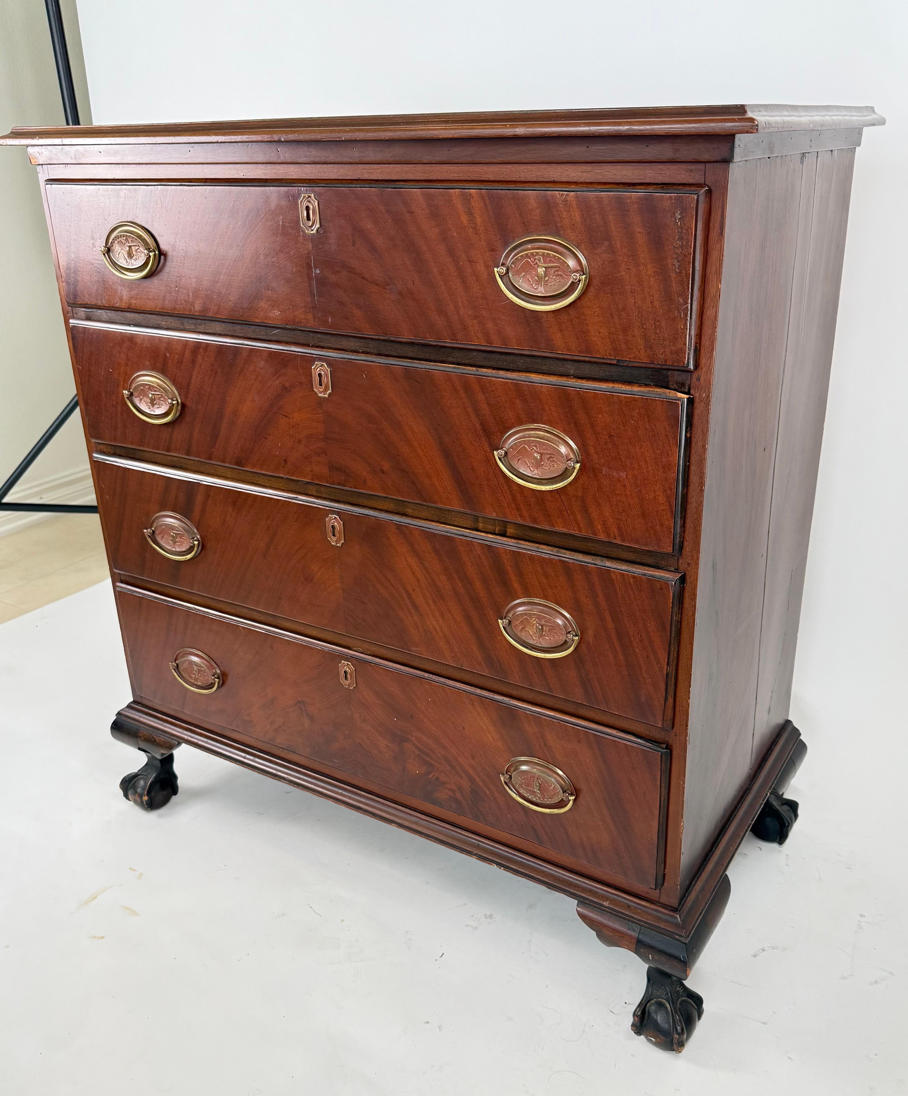 A lovely, well made and sturdy Georgian style chest of drawers from the 1890's.  The chest is crafted of solid wood that has been 